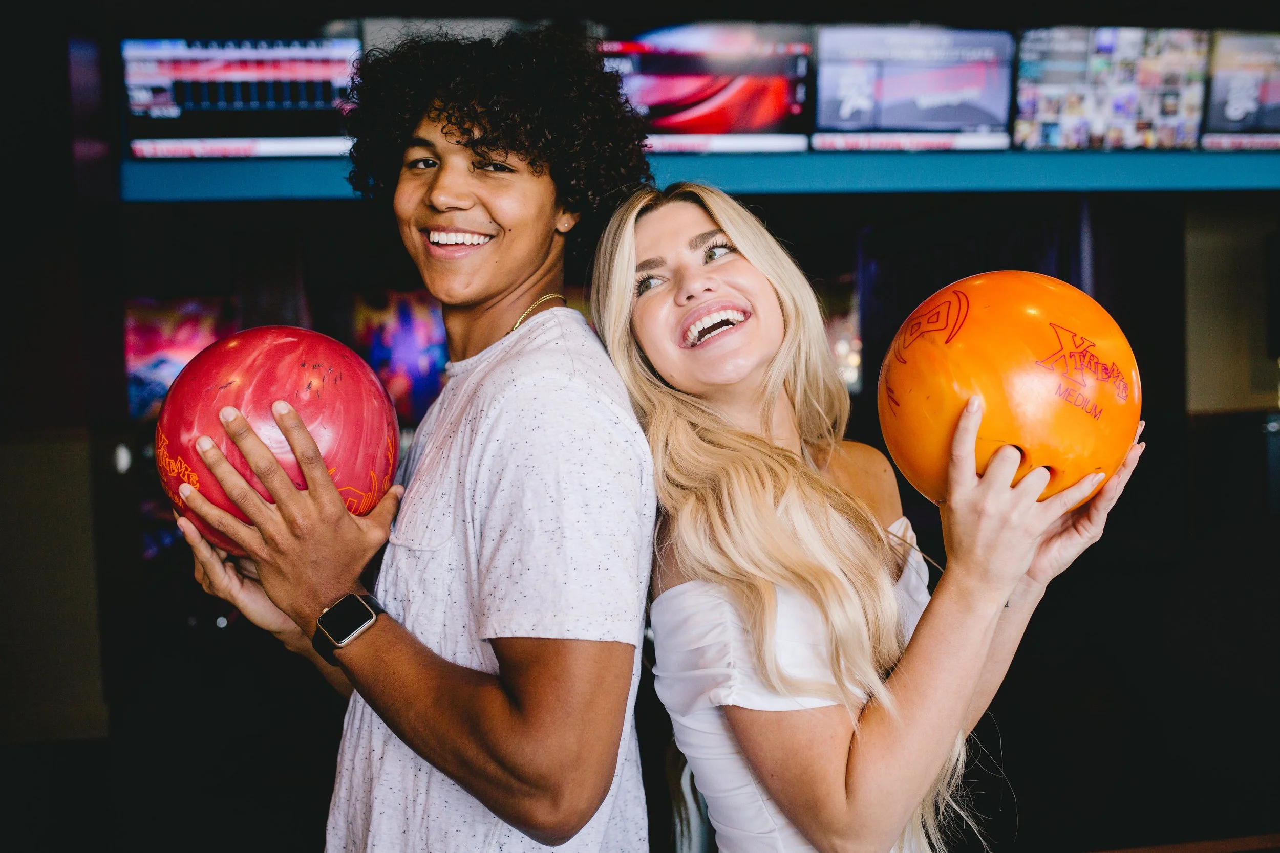 Male and female with bowling balls