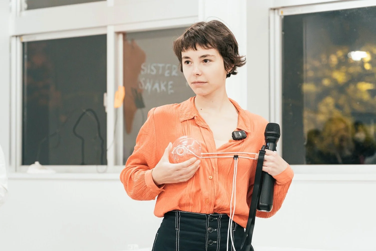 Marlene with glass sculpture and microphone