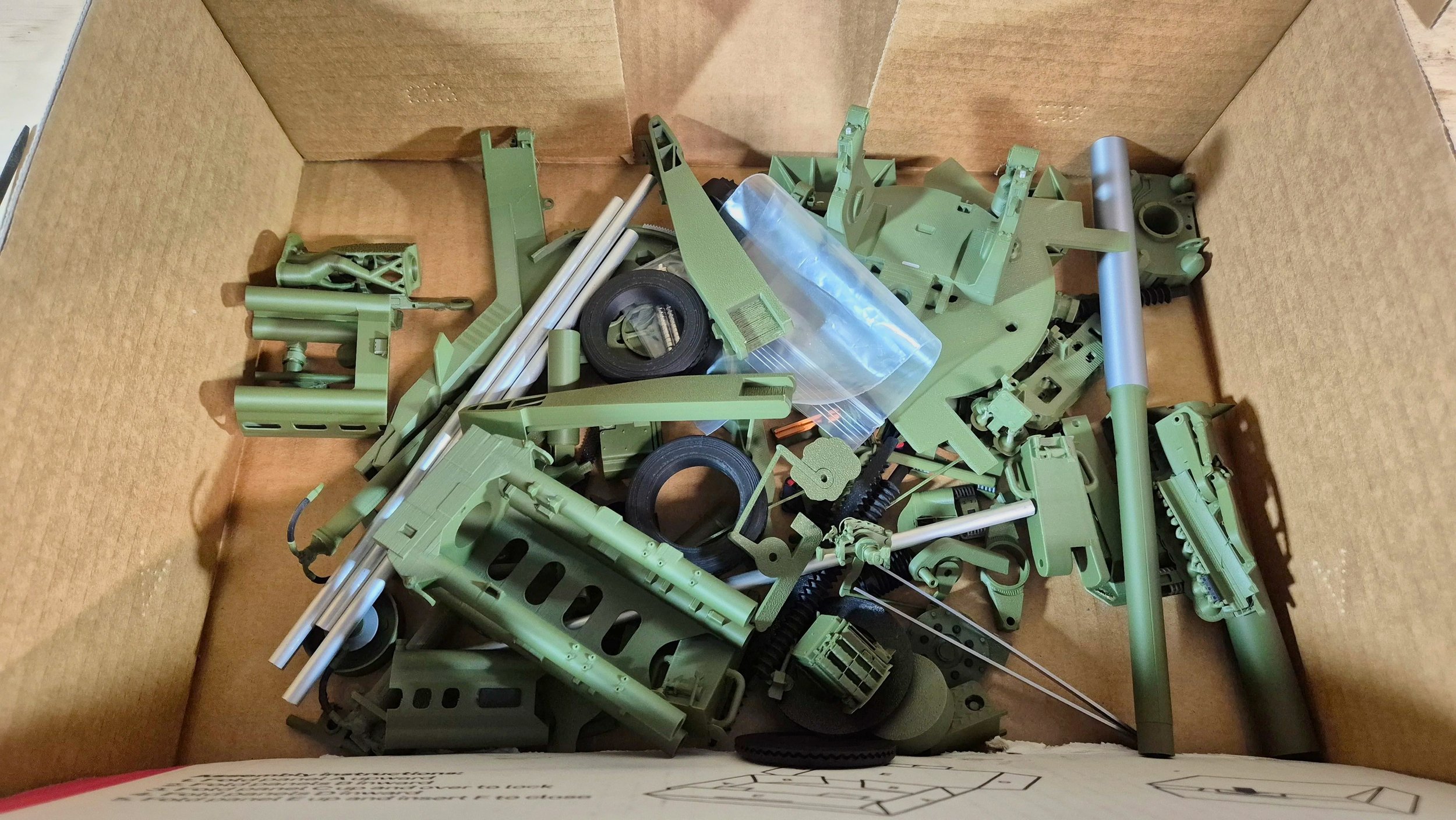 A box of parts ready to build for a 1:16 M777
