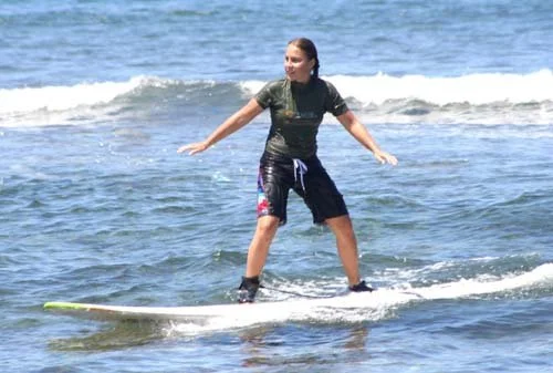 Jillian learning to surf in Maui, Hawaii
