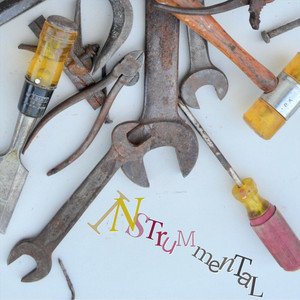 Various old and rusty tools, including wrenches, screwdrivers, and a pencil, arranged around the word 'INSTRUMENTAL' written with colorful letters and a 3D effect.