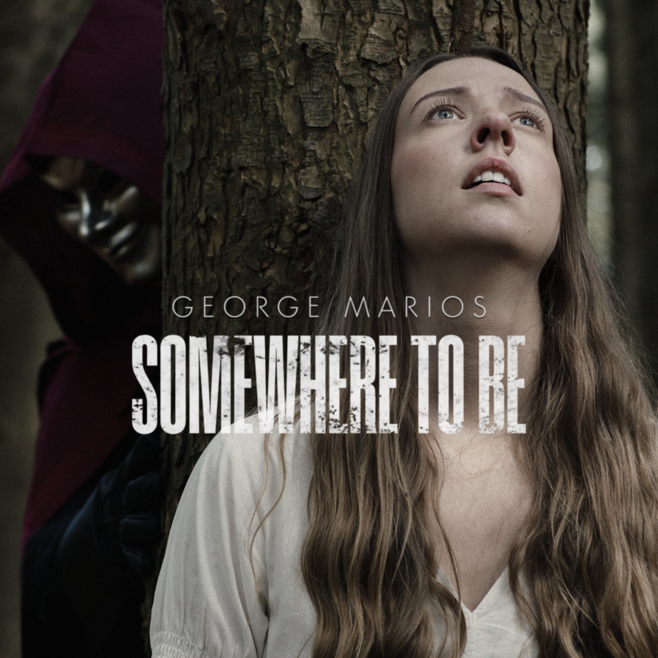 A woman with long hair looks up against a tree with a distressed expression; partially obscured figure in dark clothing and mask stands behind the tree. Text on image: "George Marios, Somewhere to Be."