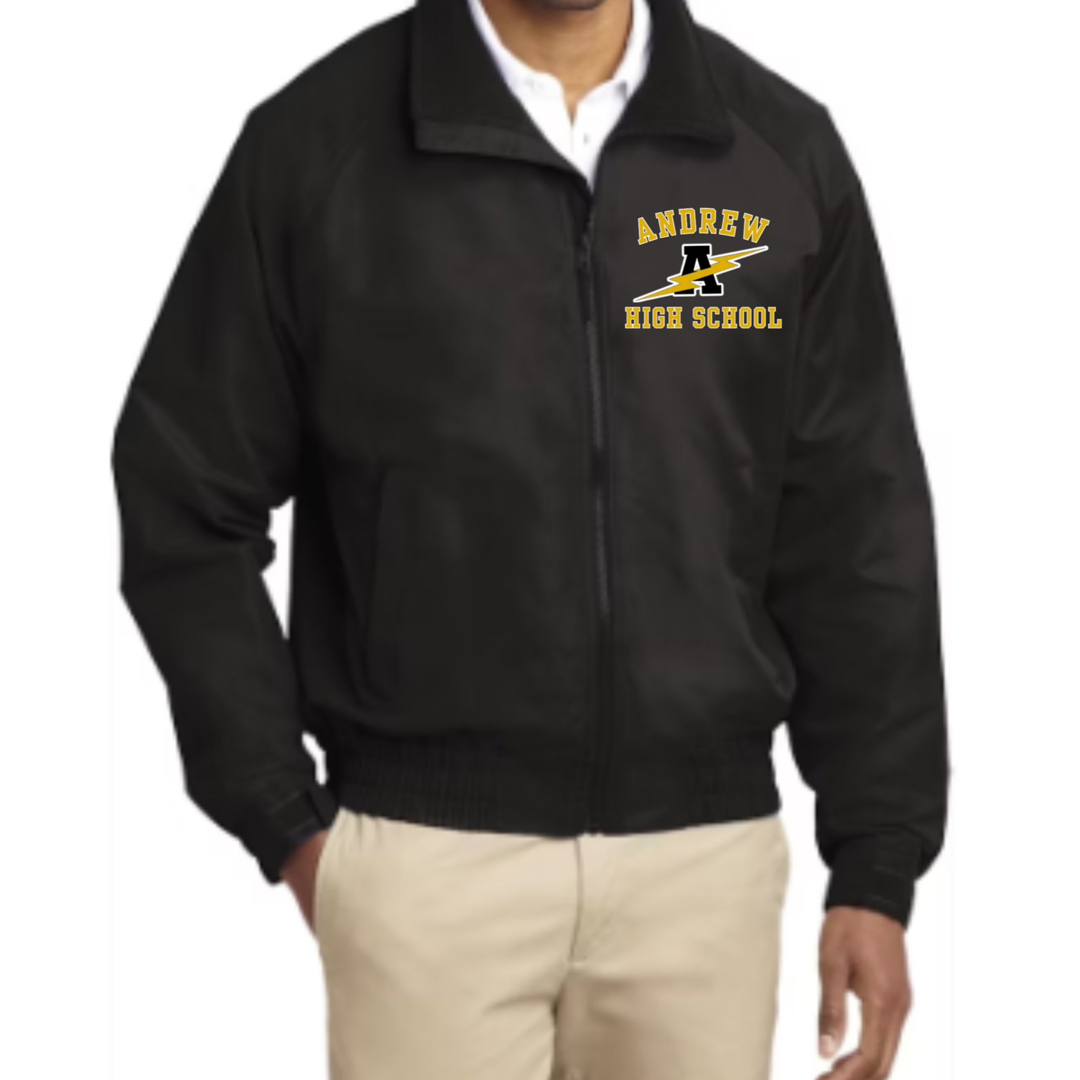 A man wearing a black jacket with a high school logo that says 'Andrew High School' and features a lightning bolt, paired with beige pants.