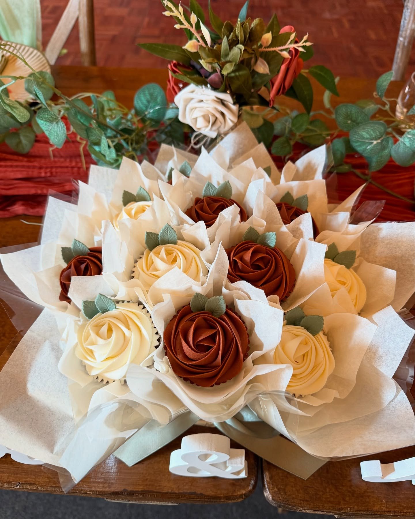 Congratulations to Georgia &amp; Jack who were married today @stanfordfarmweddings 

The cupcake bouquets had two different flavours, each represented by a different coloured rose. The copper coloured roses and the ribbon and leaves tied in with the 
