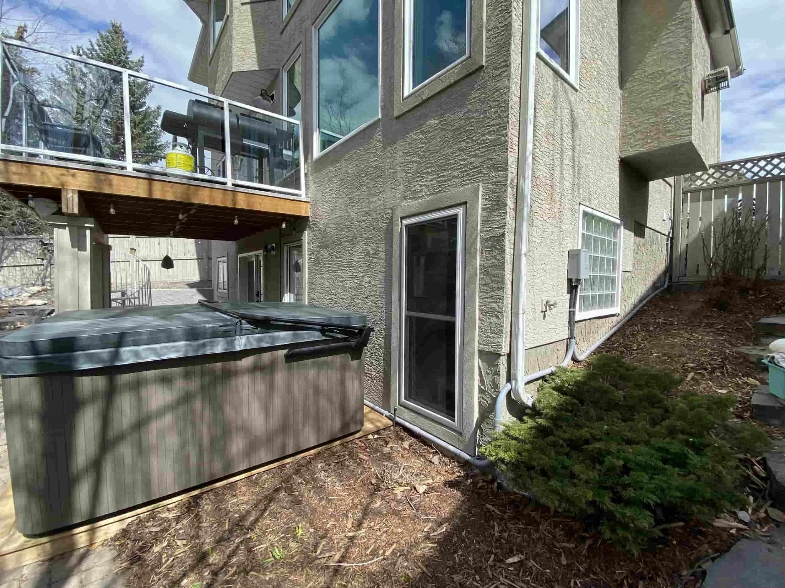 Hot tub wiring and sub-panel installation in a Calgary backyard by FuseSmart Electric. 