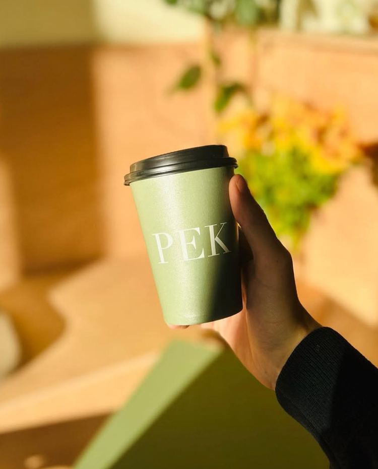 PEK coffee cup in the sun