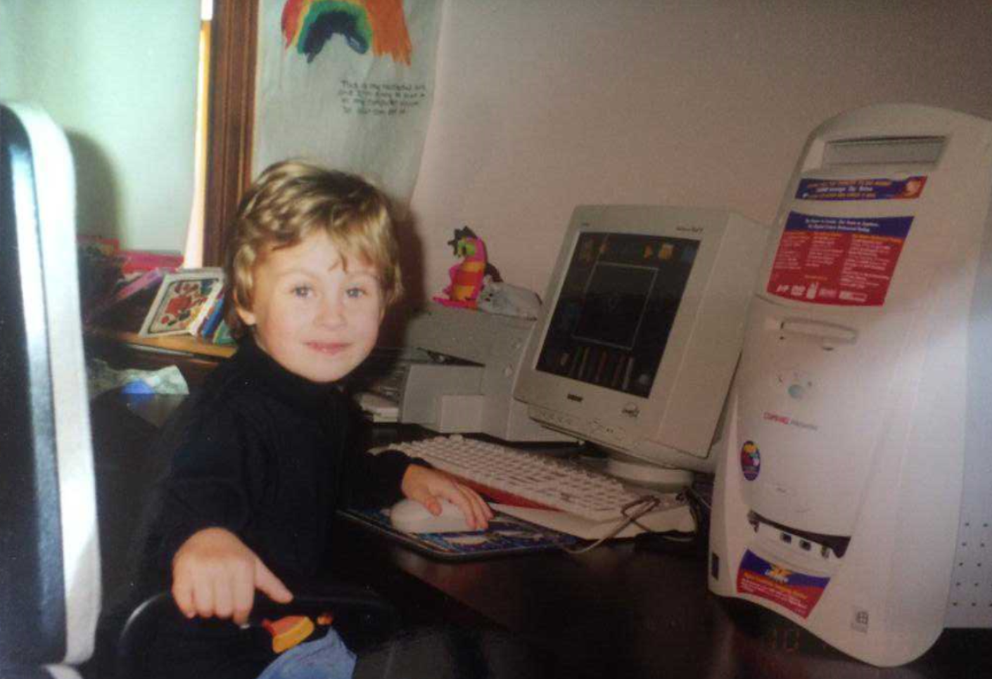 A 4 year old girl with blond hair in a pixie cut sits in front of a Compaq Presario. The year is 2000 and she is playing Blues Clues: Art Time Activities. This is the first documentation of Lydia Symchych playing a video game.