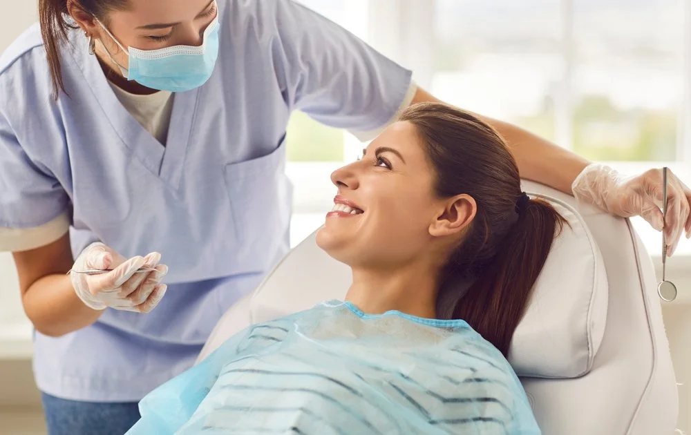 dentist placing tooth colored filling to repair a cavity and protect the natural tooth
