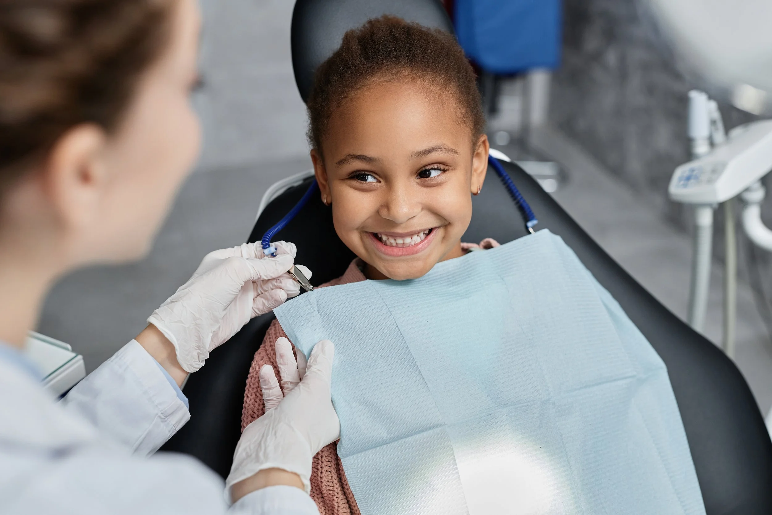 Pediatric dentist providing preventive dental care for a child in Shreveport Bossier City dental office