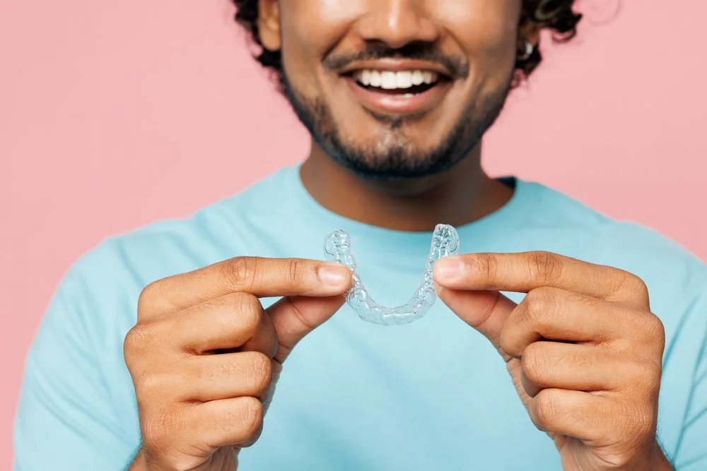 clear aligner treatment using removable trays to gradually move and straighten teeth