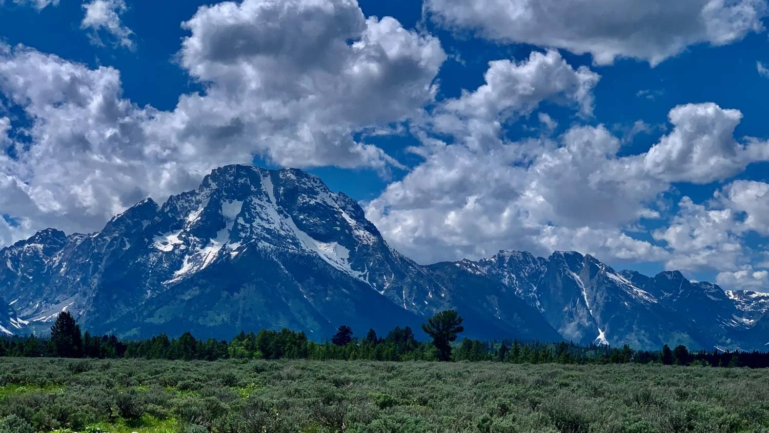 A snow-covered mountain peak in the distance