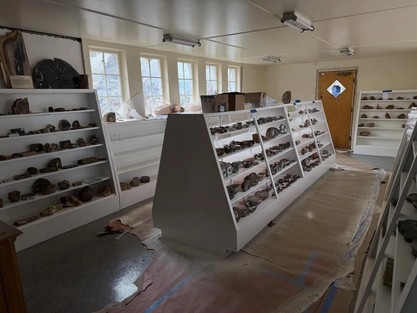 Rocks started going back in the 90 year old newly painted cabinets today!
