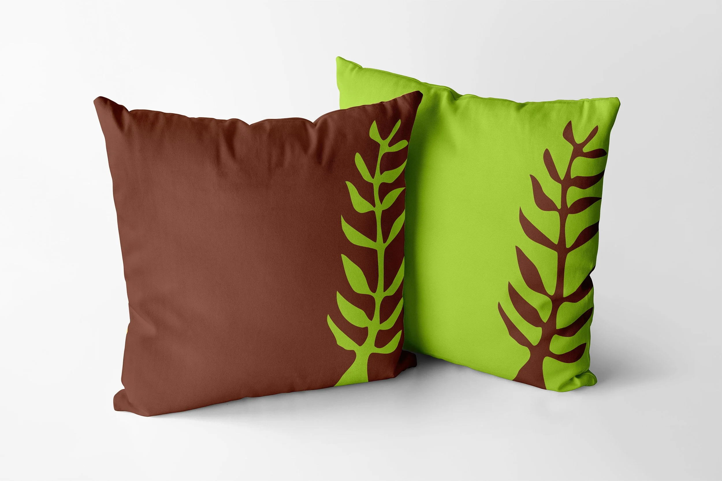 Nyame Nti cushions in chocolate and key lime.