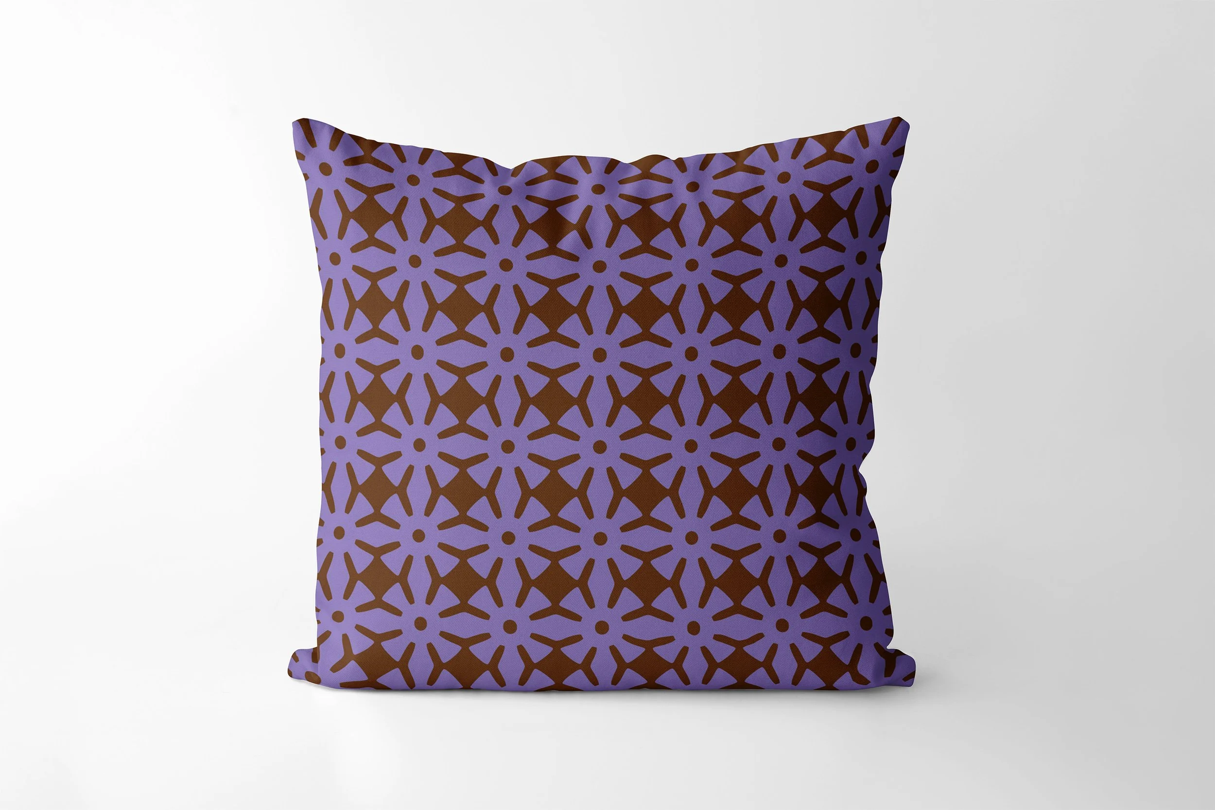 Ananse Ntontan cushion in plum and chocolate.