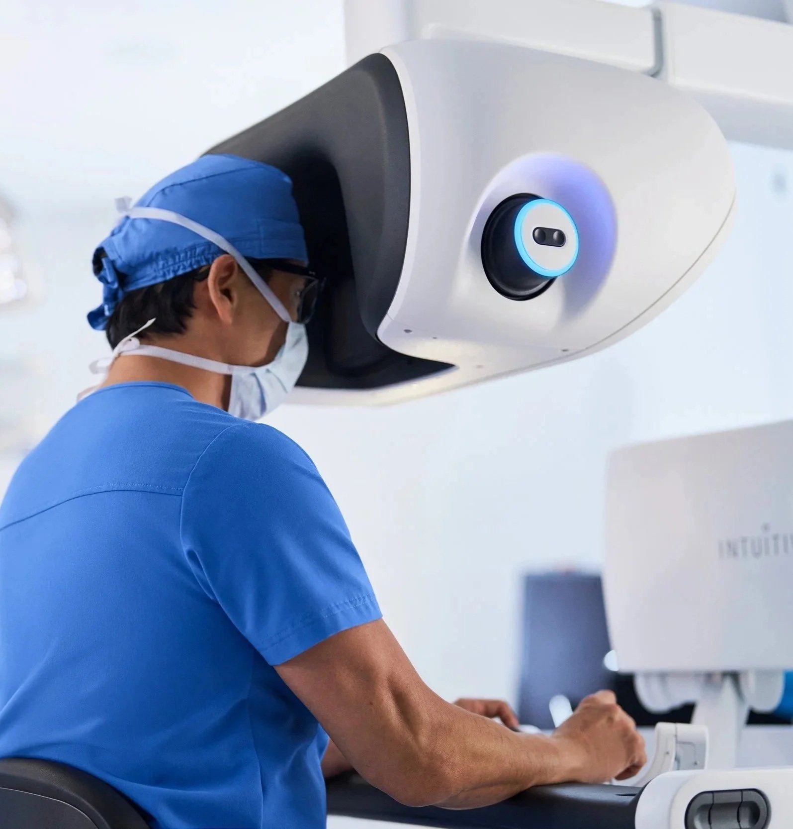 Surgeon at an Intuitive da Vinci 5 console.