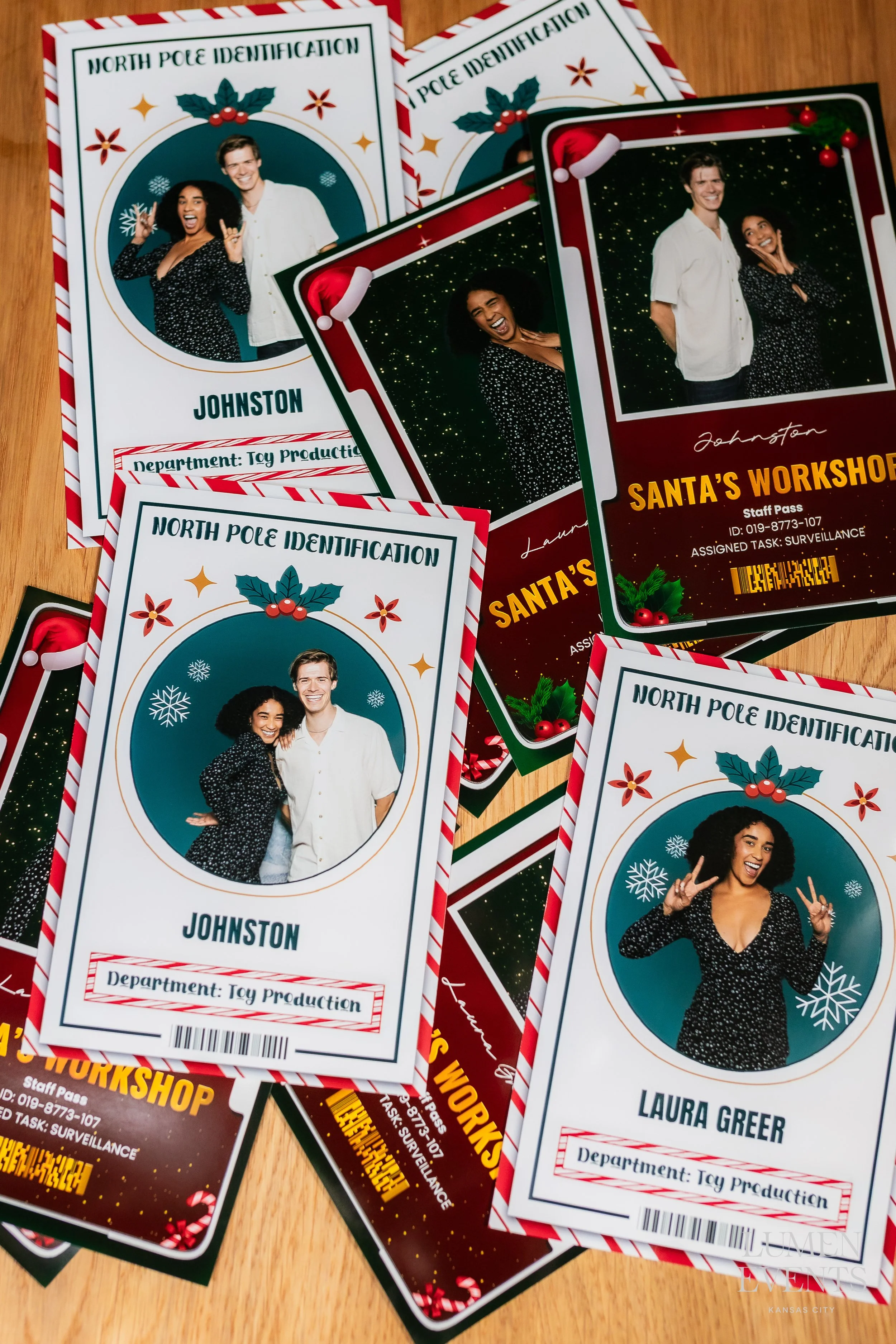 Custom North Pole photo ID badges from Lumen Events’ Santa’s Workshop booth, featuring festive guest portraits with holiday graphics, names, and playful department titles like ‘Toy Production.