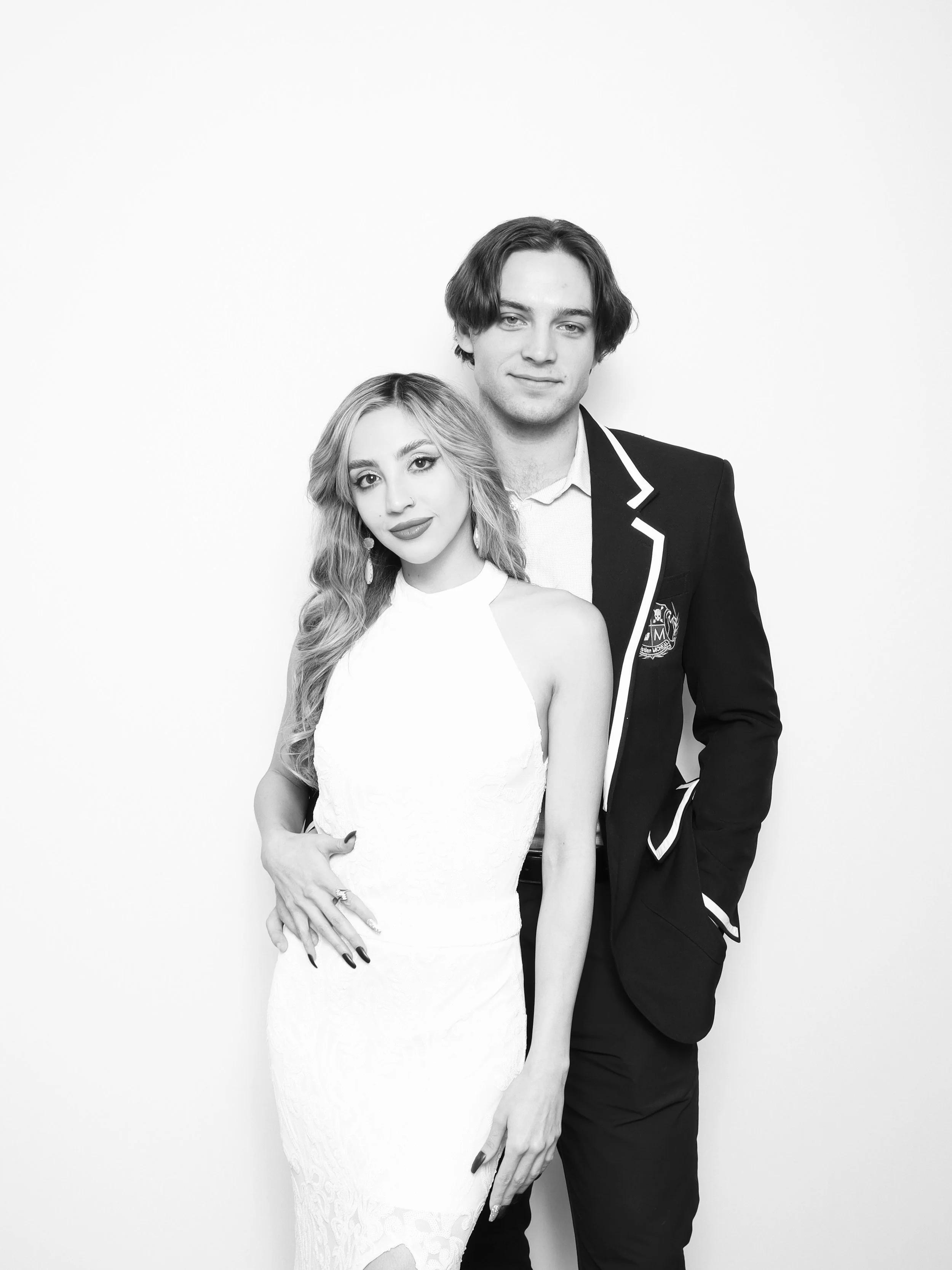 Wedding couple in timeless black and white photo booth portrait with minimal backdrop