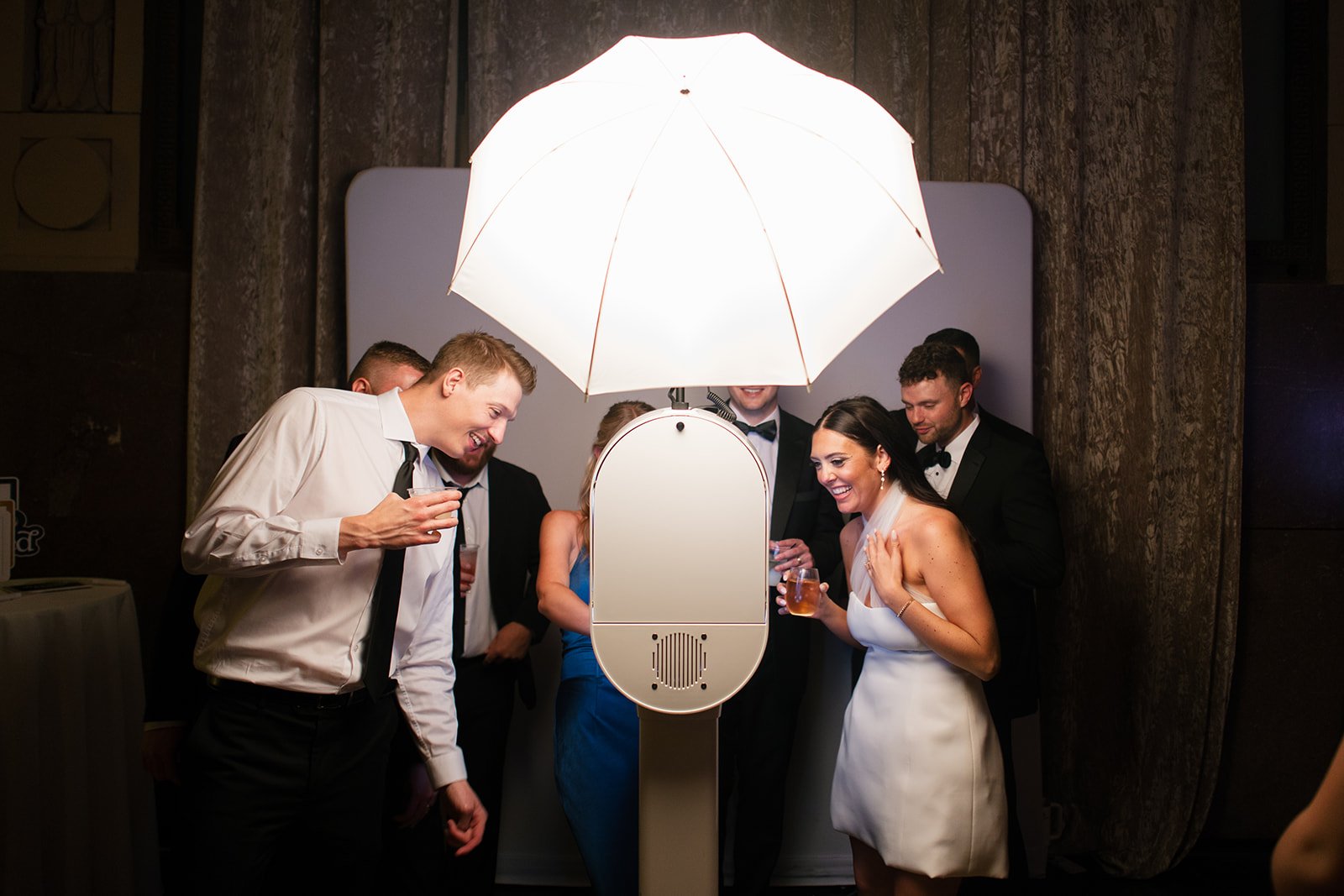 Sophisticated photo booth in Union Station Kansas City Grand Hall wedding venue with historic architecture and soaring ceilings
