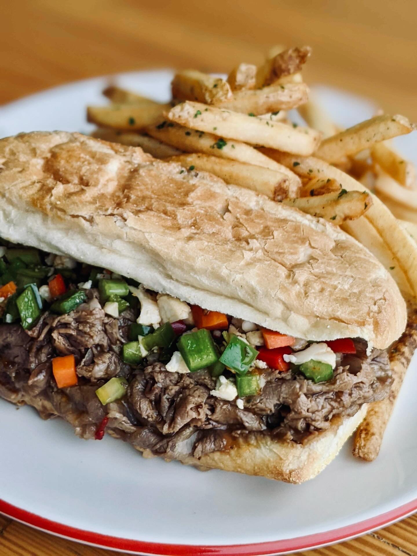 New sandwich special in the house 🥖

Our Chicago-style Italian Beef is stacked with slow-roasted prime rib, dunked in au jus, layered with house-made giardinara peppers, and served on toasted French bread.

$28, served with fries.

Come hungry. 😋