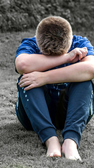 child crying image for Coping with Grief and Loss: Navigating the Journey of Healing blog