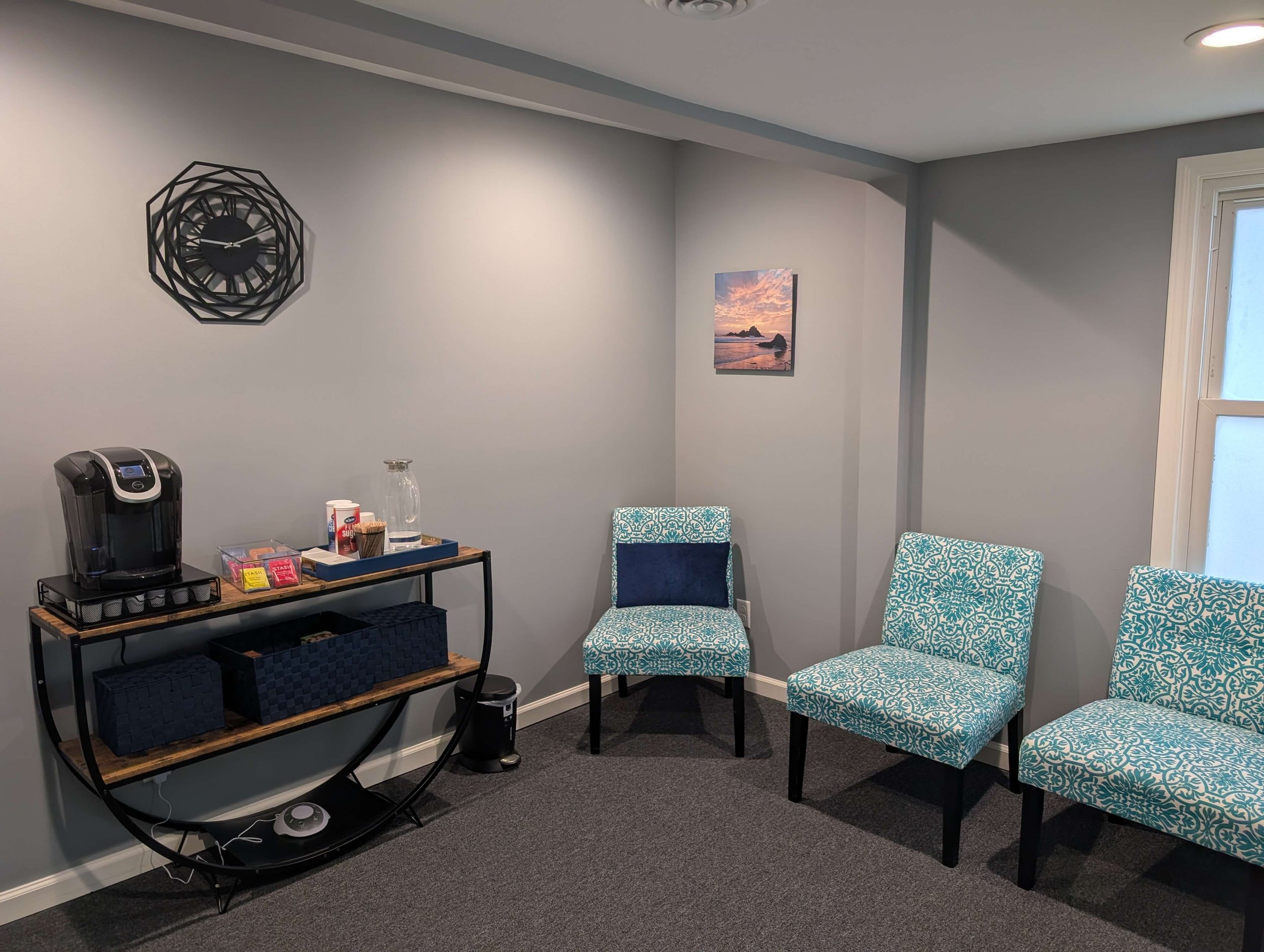 Shared client waiting room with beverage station in Downers Grove office