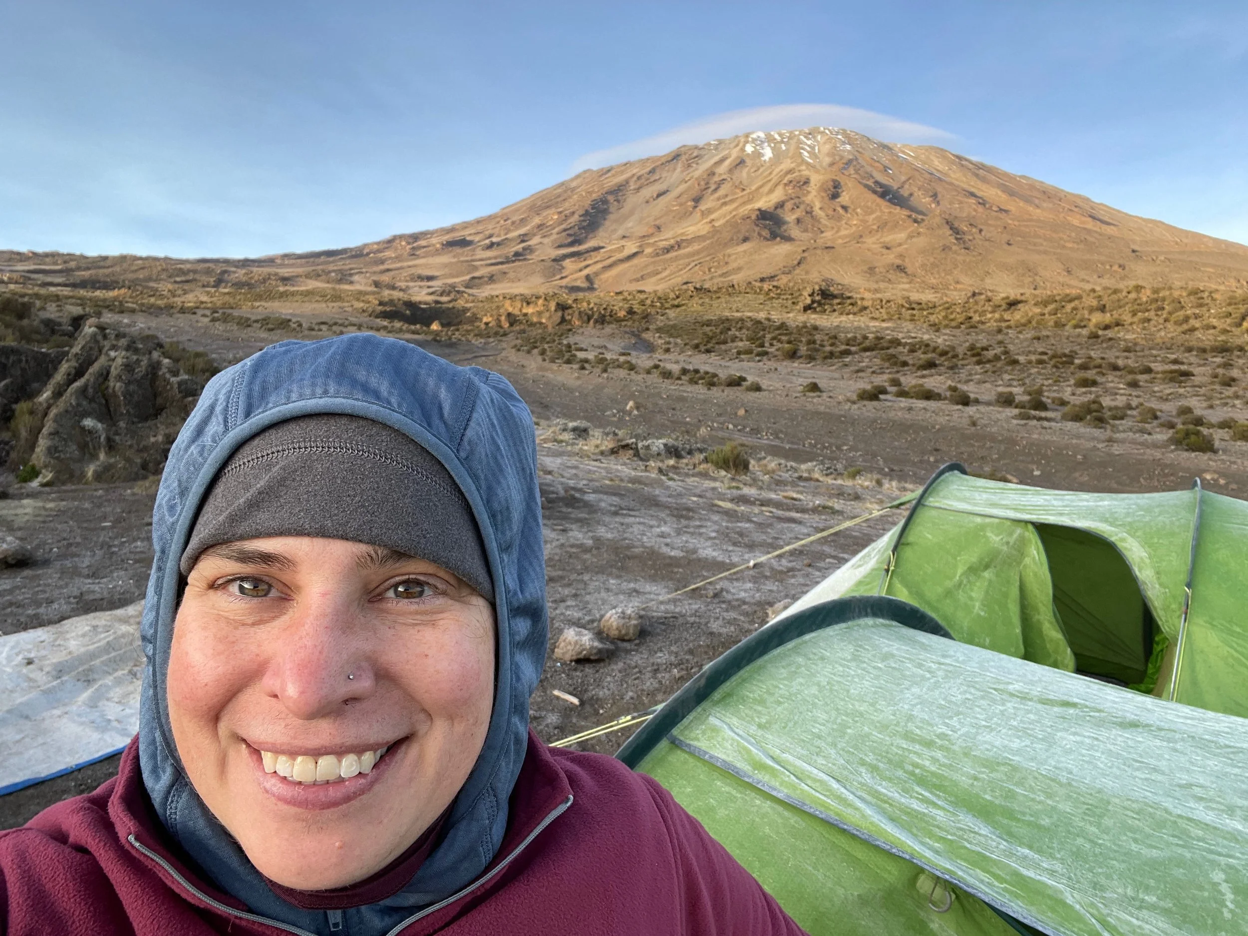 Morning selfie with Kibo in the background, getting a little closer each day. You can see the frost on our tents here.