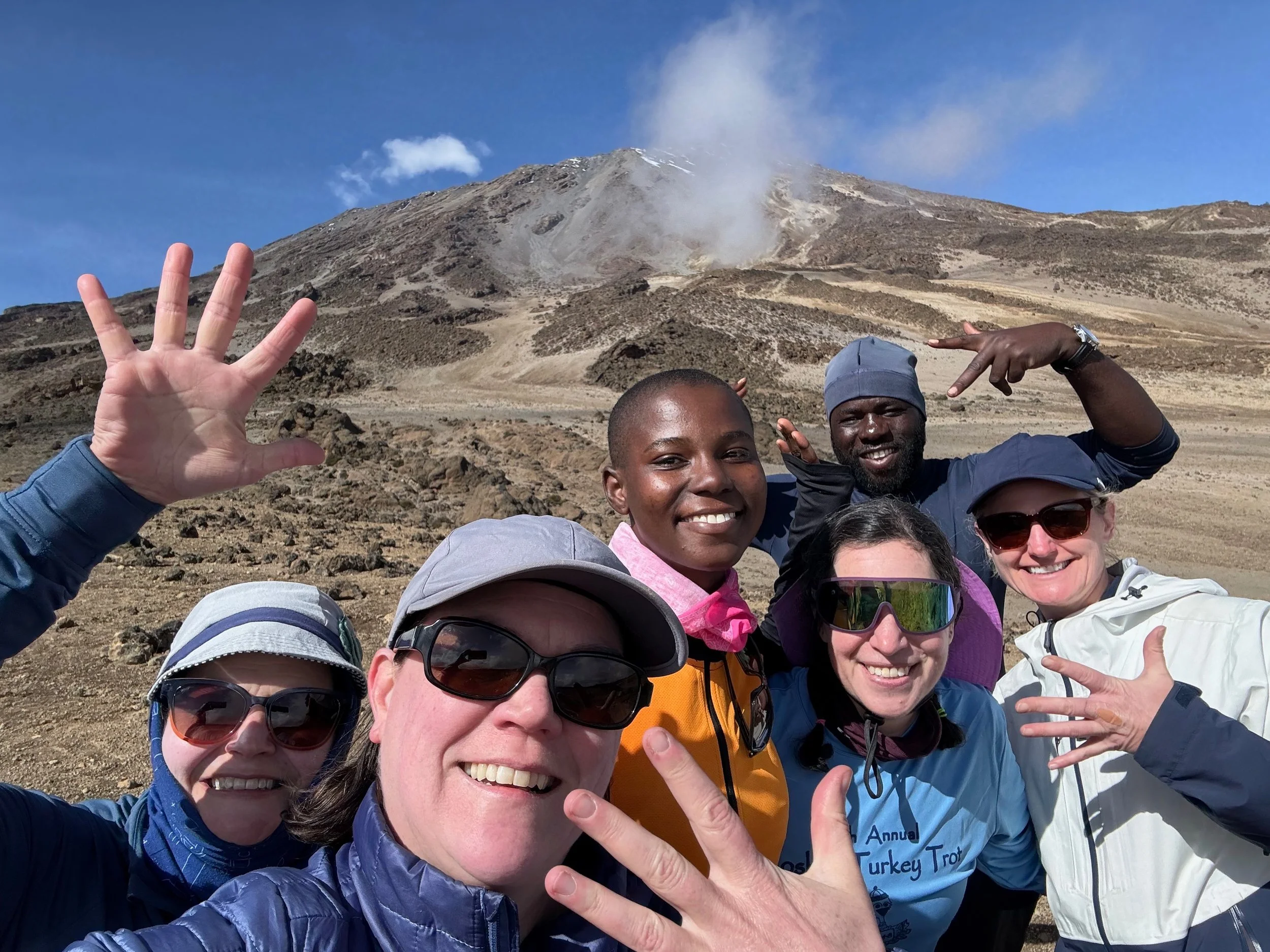 Heading out on day 5 with our guides, Lucina and Freddy. Kibo getting ever closer in the background. January 12, 2026