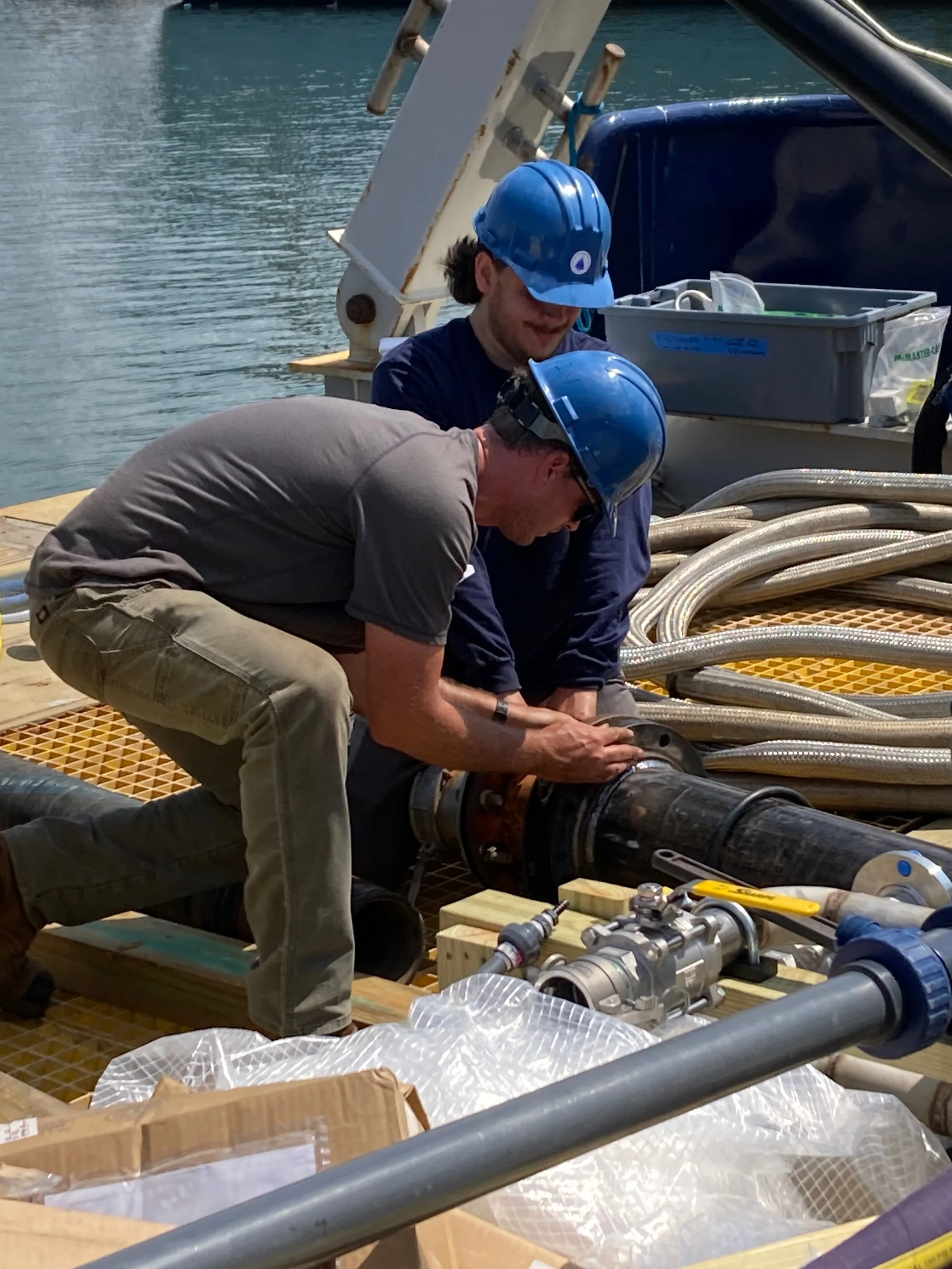 WHOI engineers assemble the pipework 