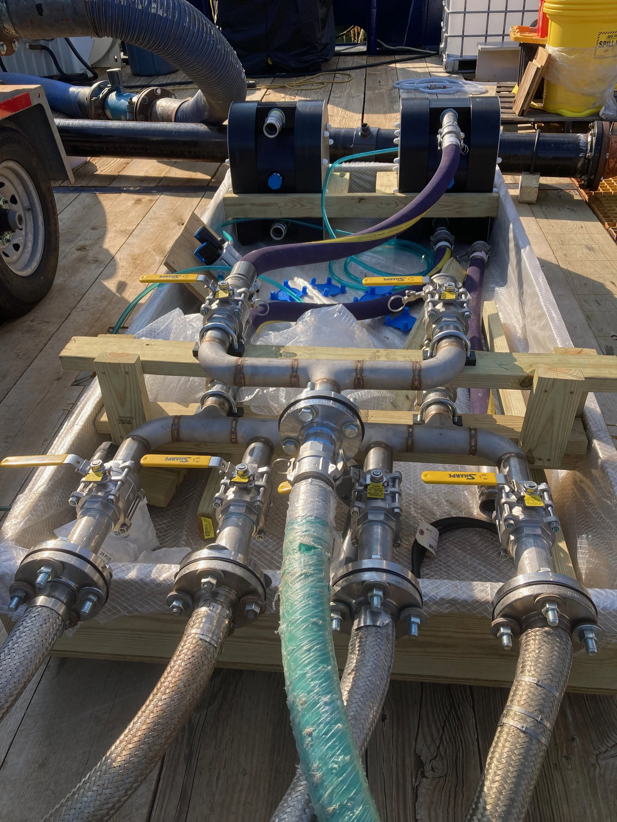 Sodium hydroxide pump and manifold