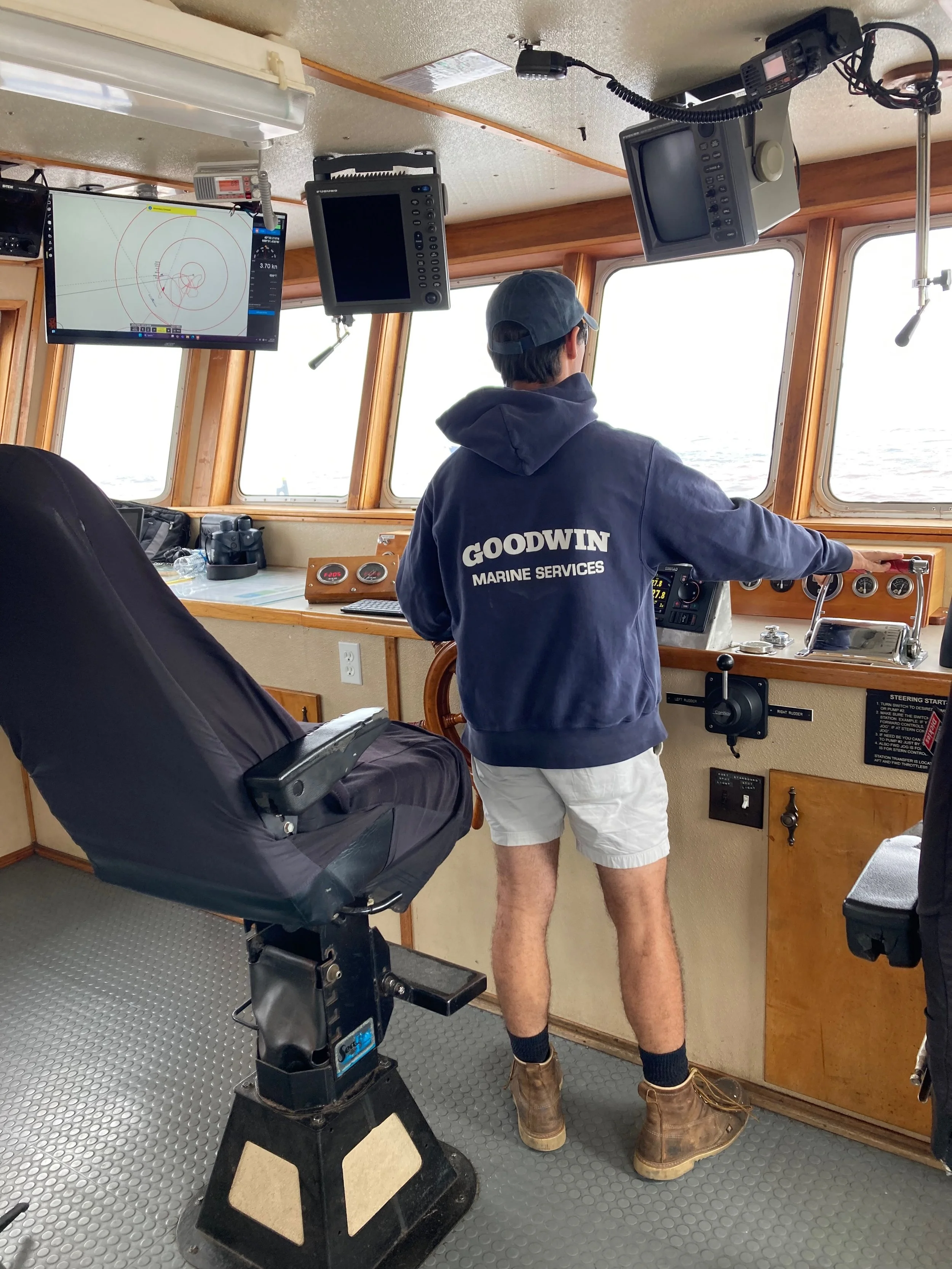 Capt. Justin Goodwin at the helm