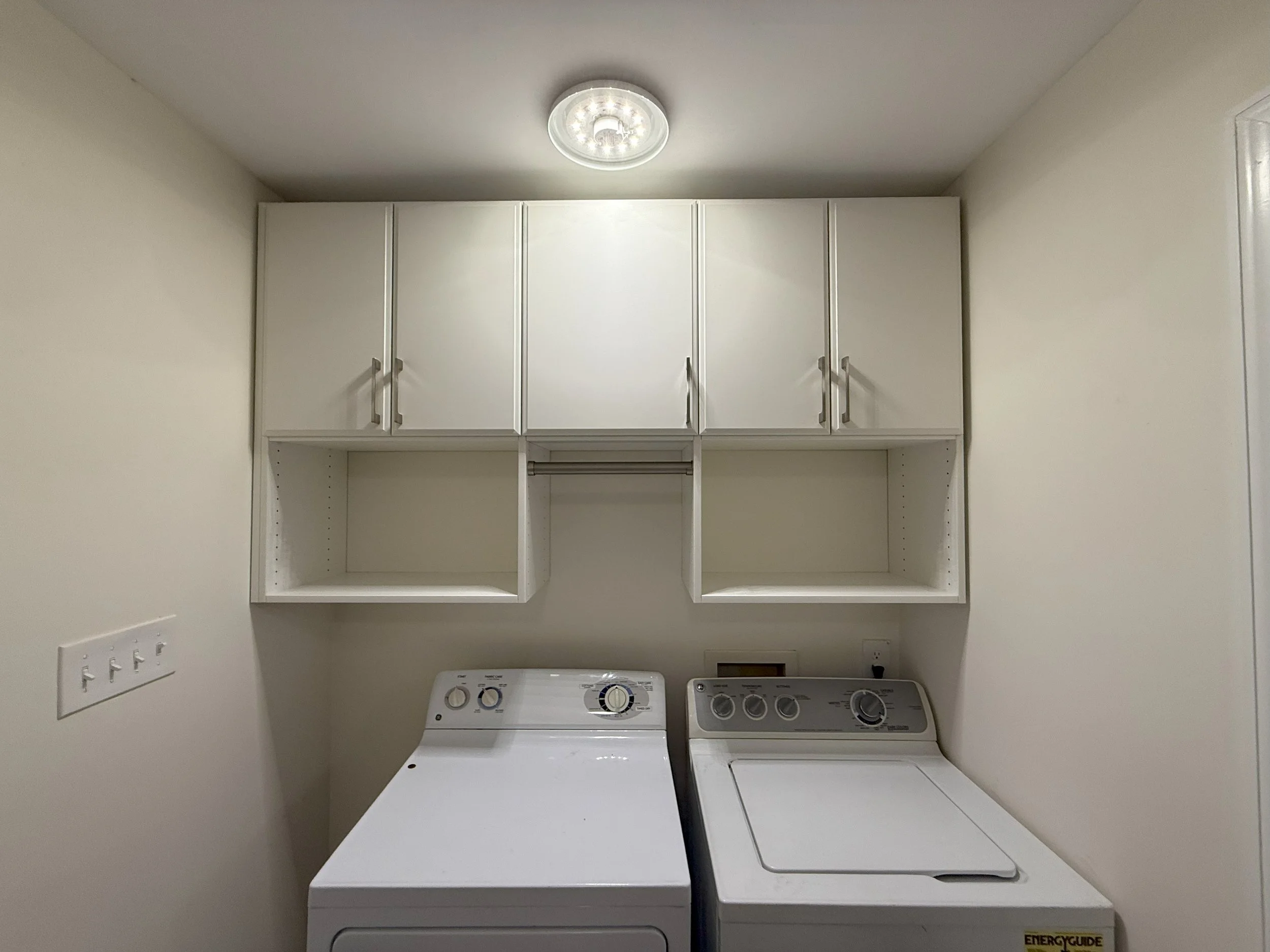 Custom laundry room cabinets and shelving