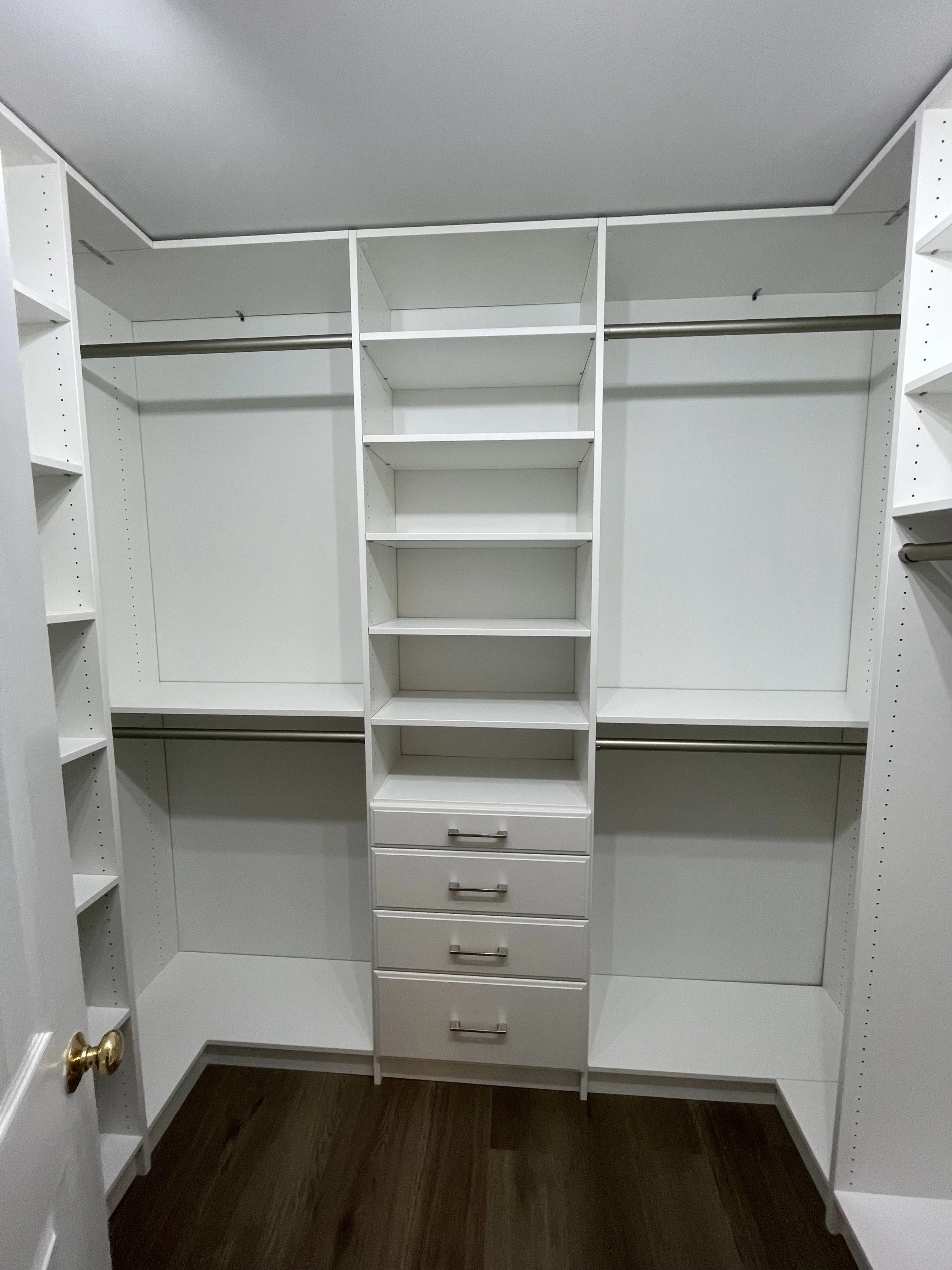 custom walk in closet with double hanging and drawers