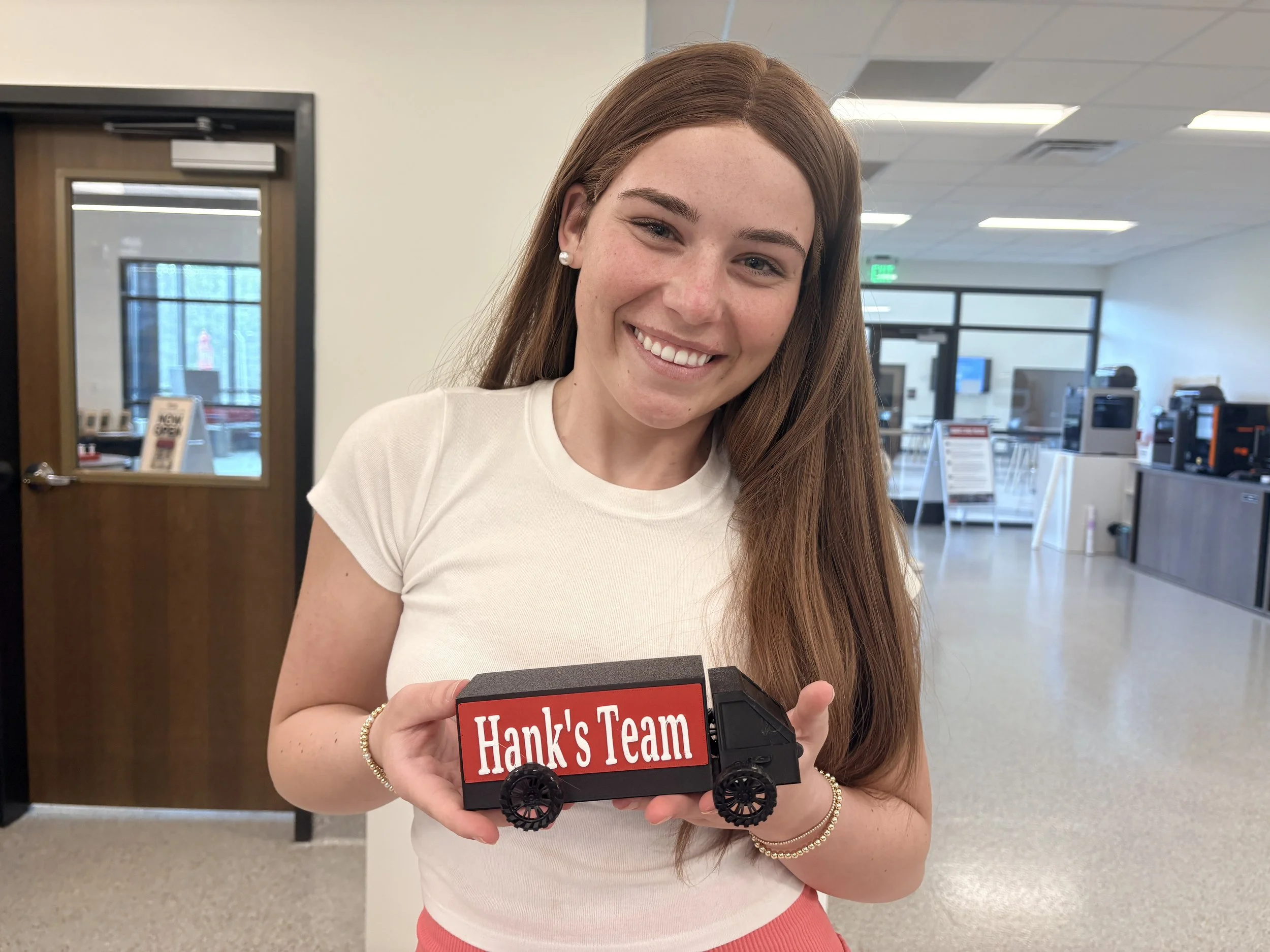 Student holding 3D printed truck