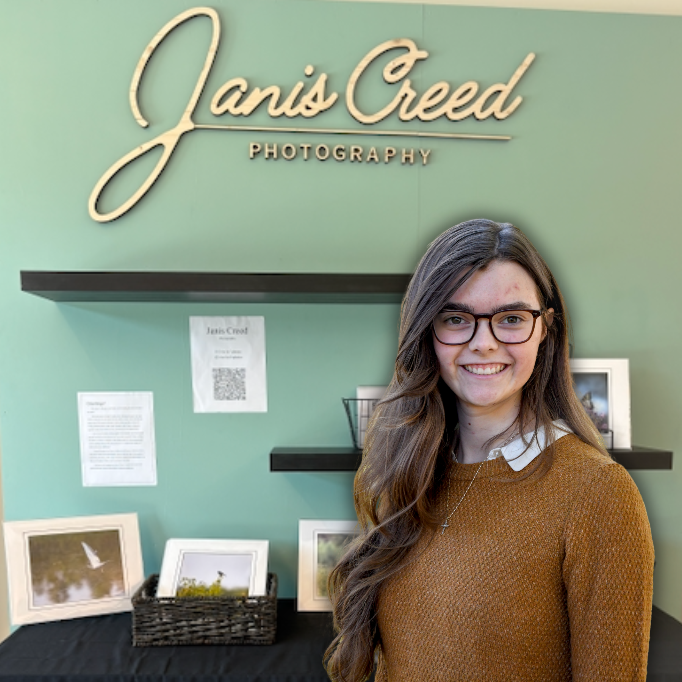 Morgan Daniel in front of Janis Creed Photography