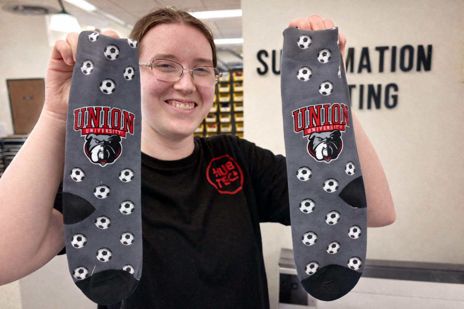 Female student holding sublimated Union socks