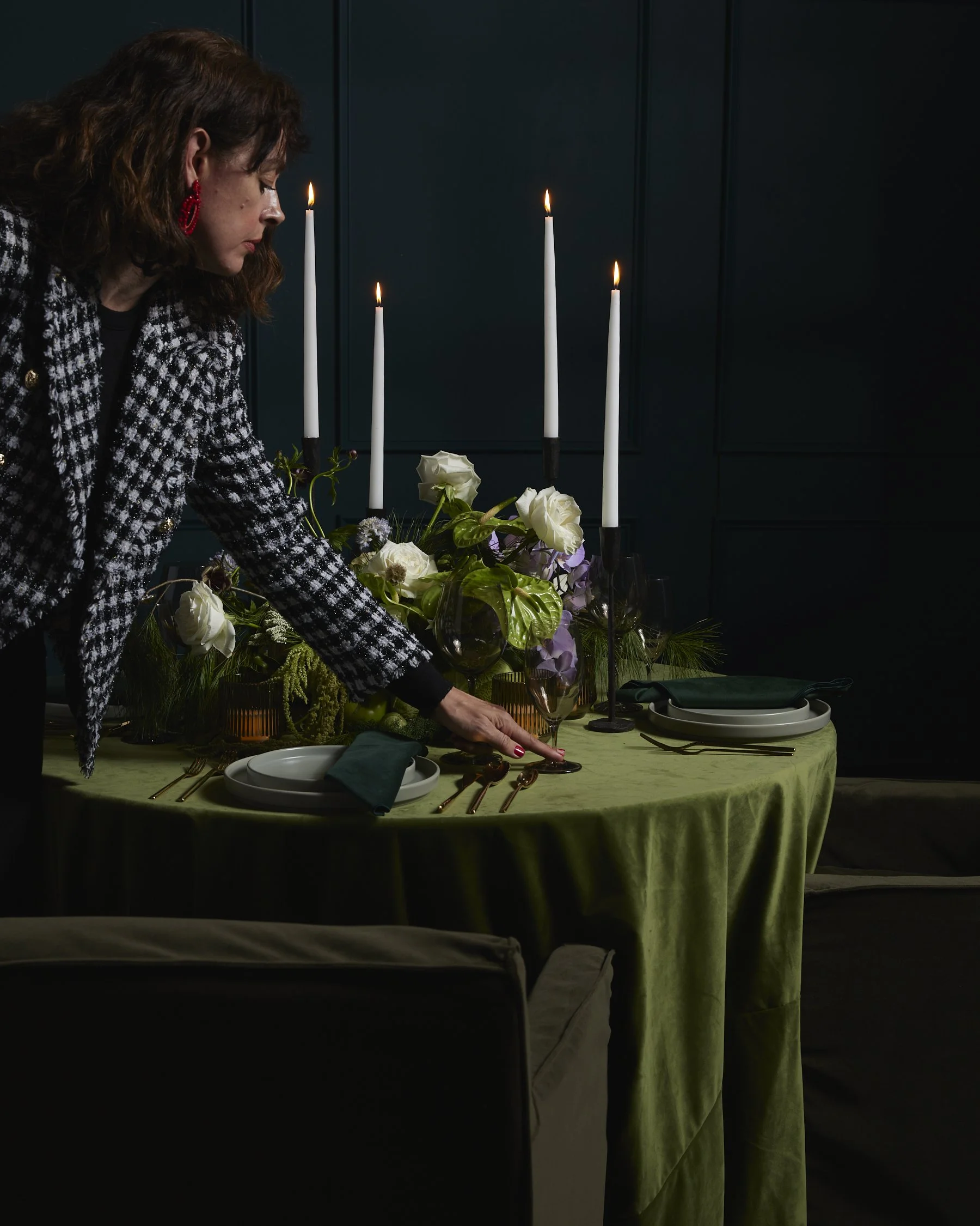 Paula Cano adjusts a modern set of dinnerware from AFA Rentals.