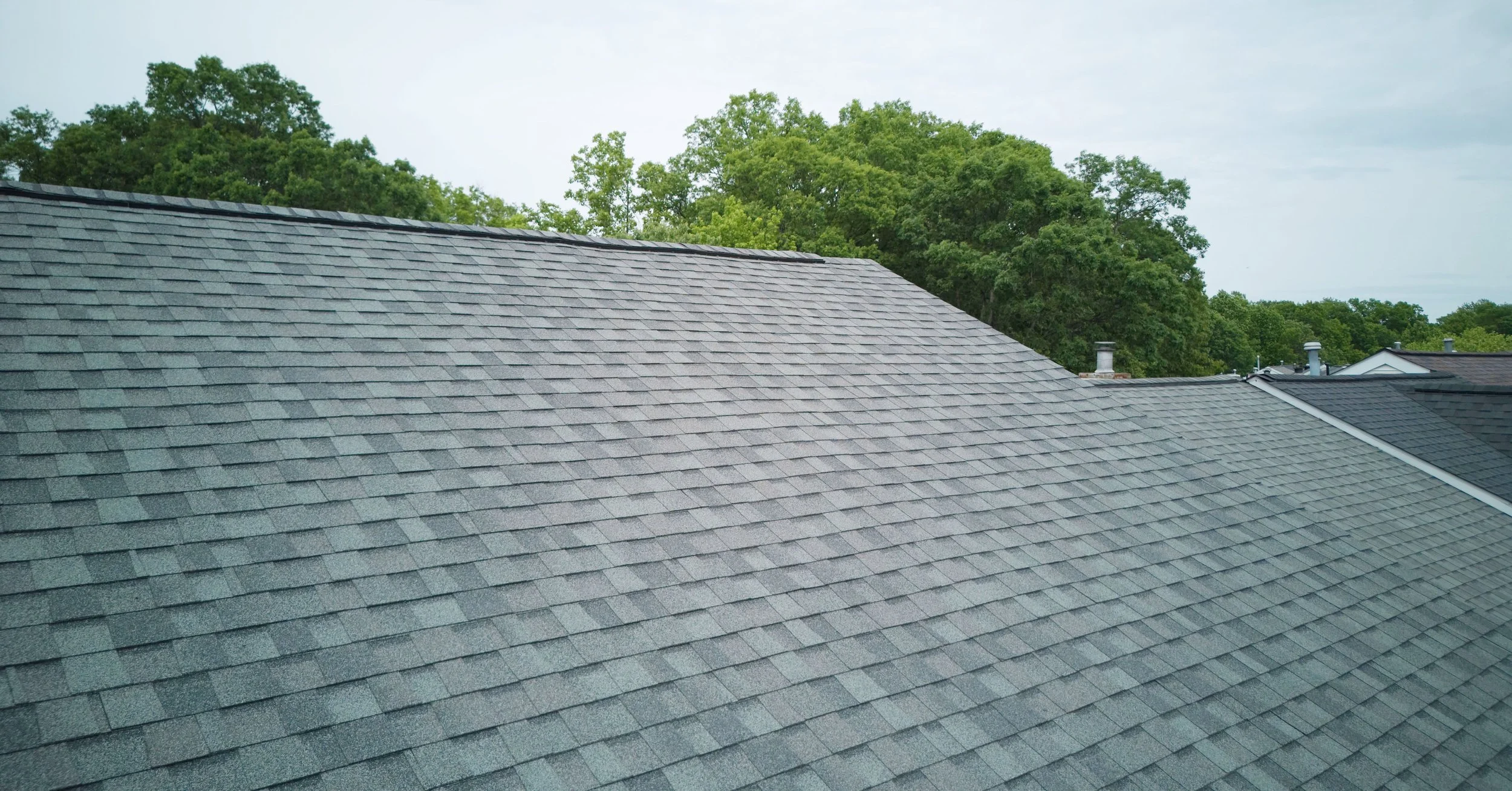 20250721-4seasonshome-rockville-dark-grey-asphalt-shingle-roof-completed-2500x1300.jpg