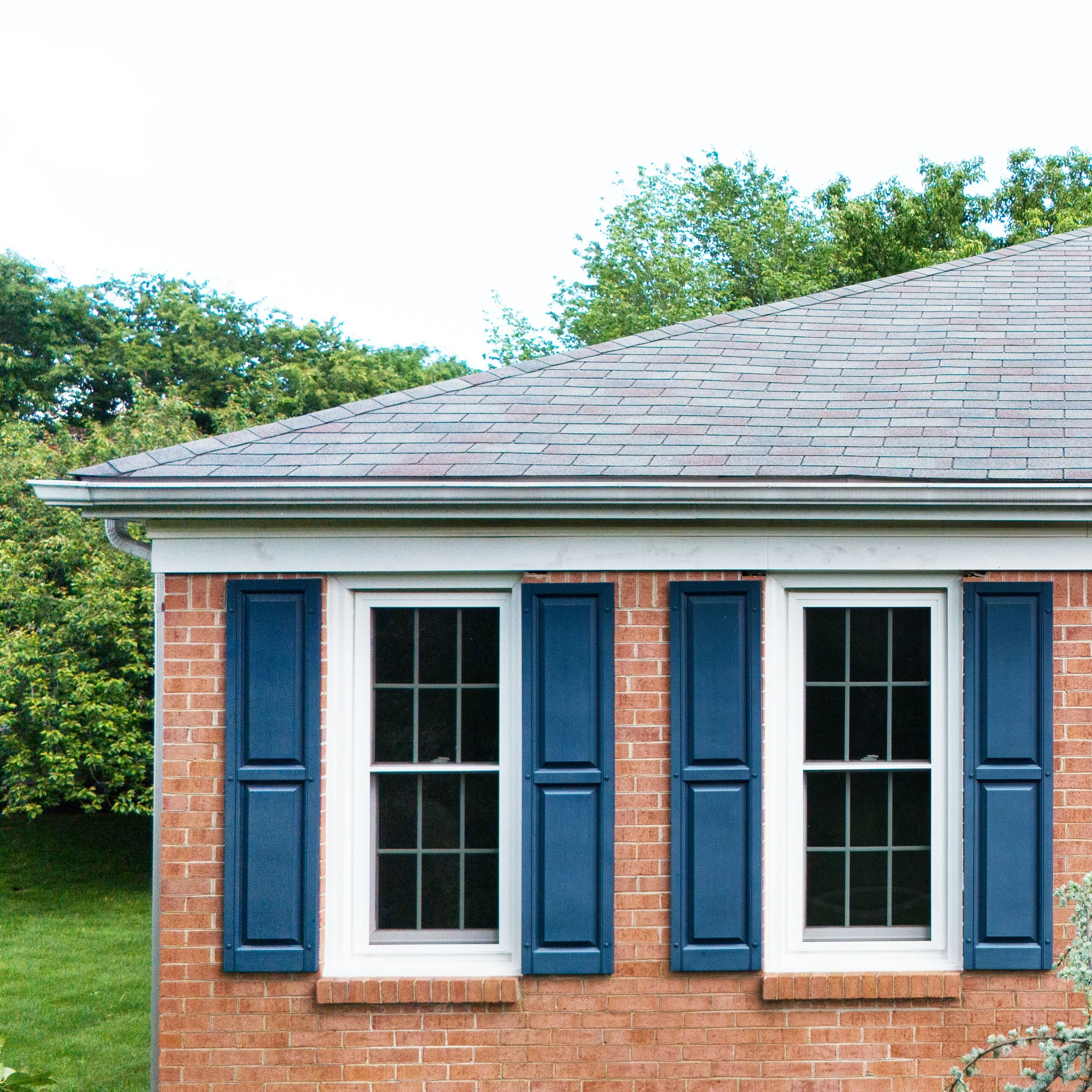 20250729-4seasonshome-rockville-window-blue-shutters-installation-red-brick-colonial-closeup-2500x2500.jpg