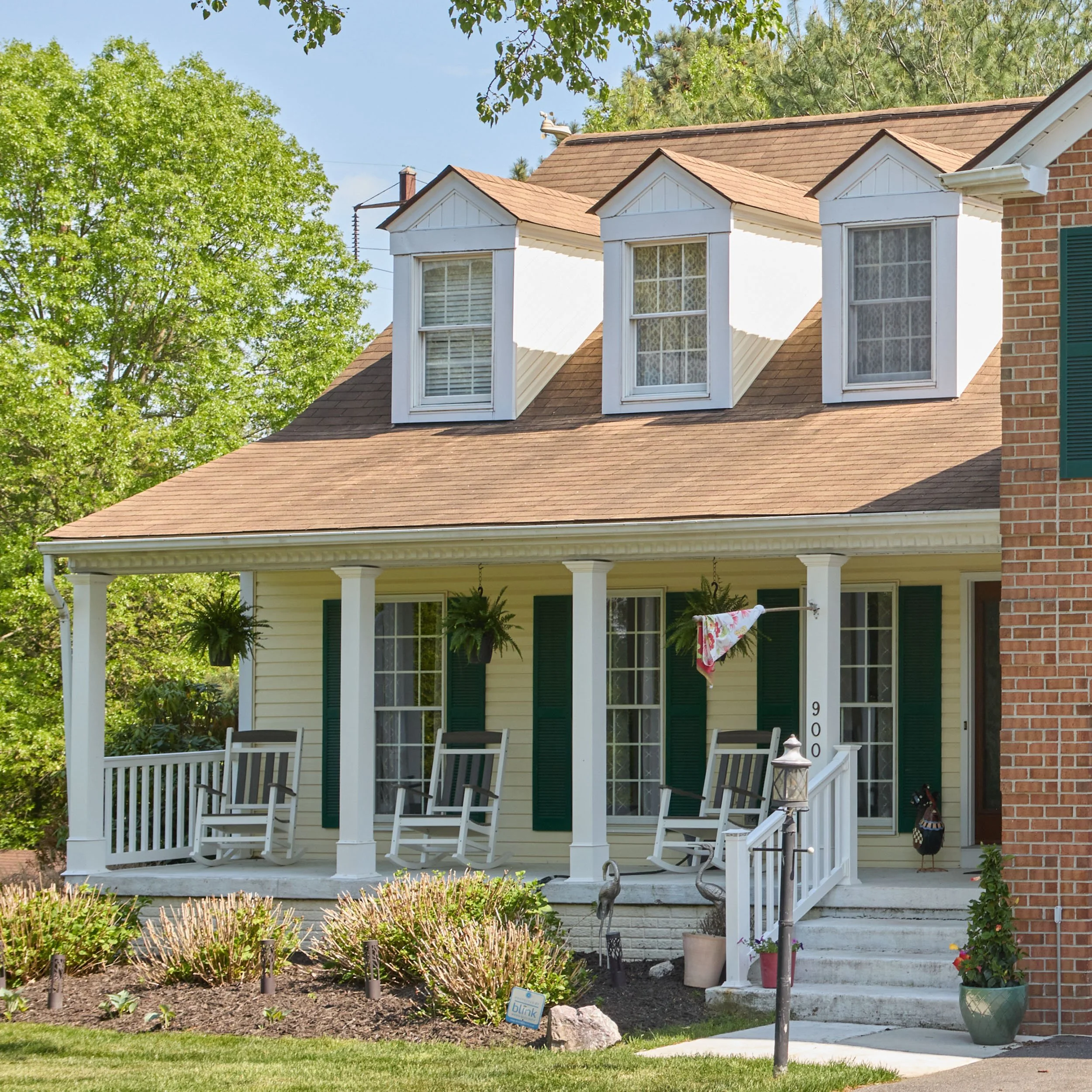 20250726-4seasonshome-rockville-brick-house-facade-porch-windows-shutters-roof-2500x2500.jpg