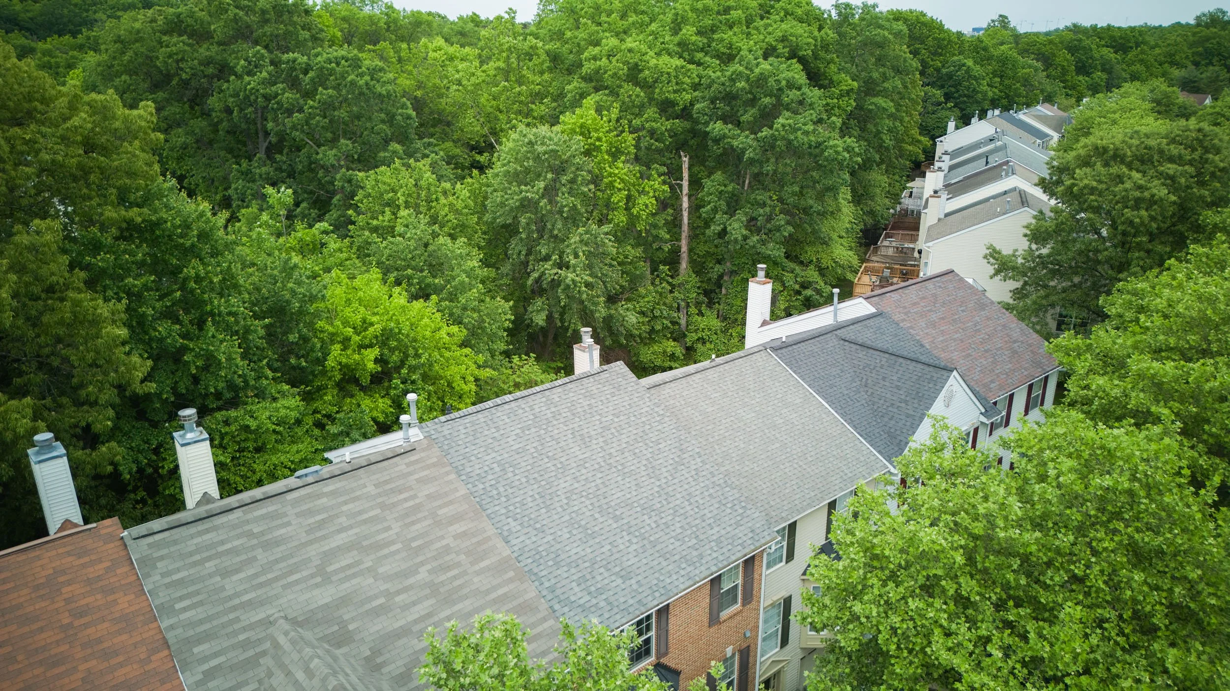 20250729-4seasonshome-rockville-grey-asphalt-shingled-roof-installation-completed-townhouse-overhead-2500.jpg