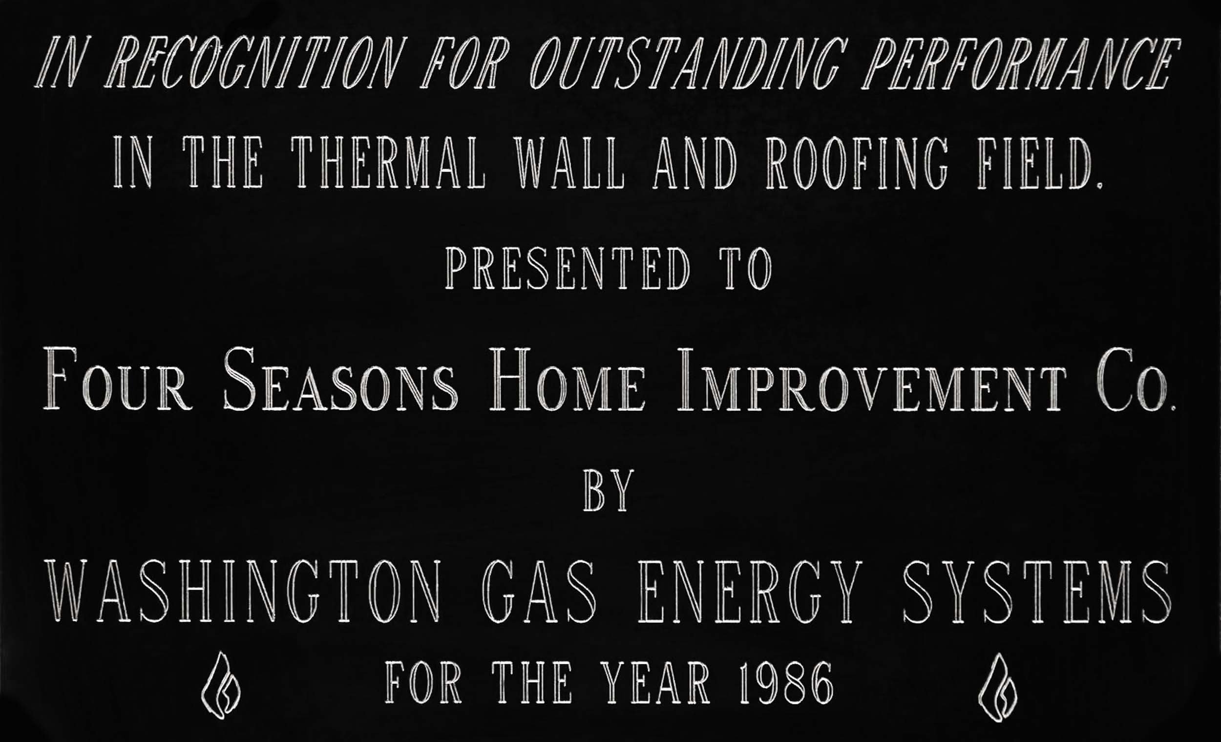 Plaque with text recognizing outstanding performance in thermal wall and roofing field, awarded to Four Seasons Home Improvement Co. by Washington Gas Energy Systems in 1986.