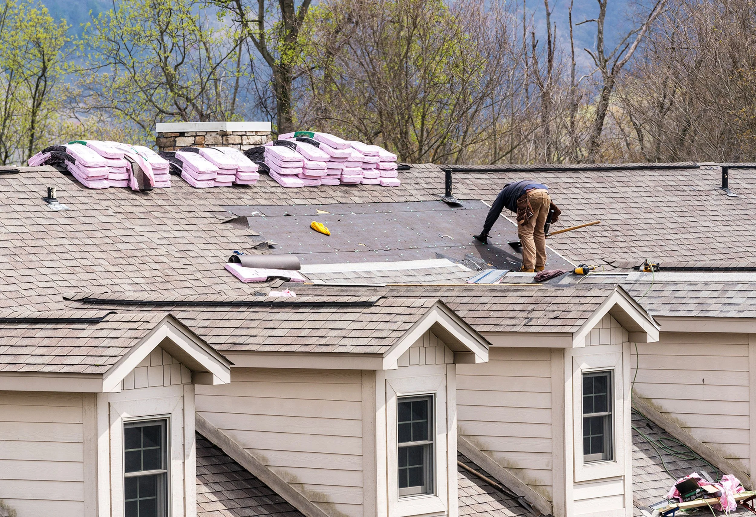 20250719-4seasonshome-rockville-professional-roofer-on-roof-replacing-asphalt-shingles-with-certainteed-underlayment-material-wip-2500.jpg