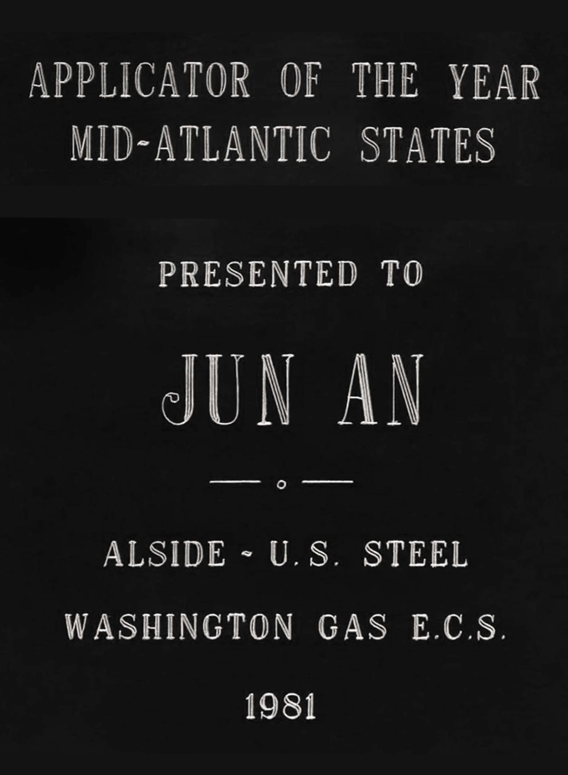 Plaque or certificate with text stating 'Applicant of the Year Mid-Atlantic States presented to Jun An. Alside - U.S. Steel Washington Gas E.C.S. 1981'.