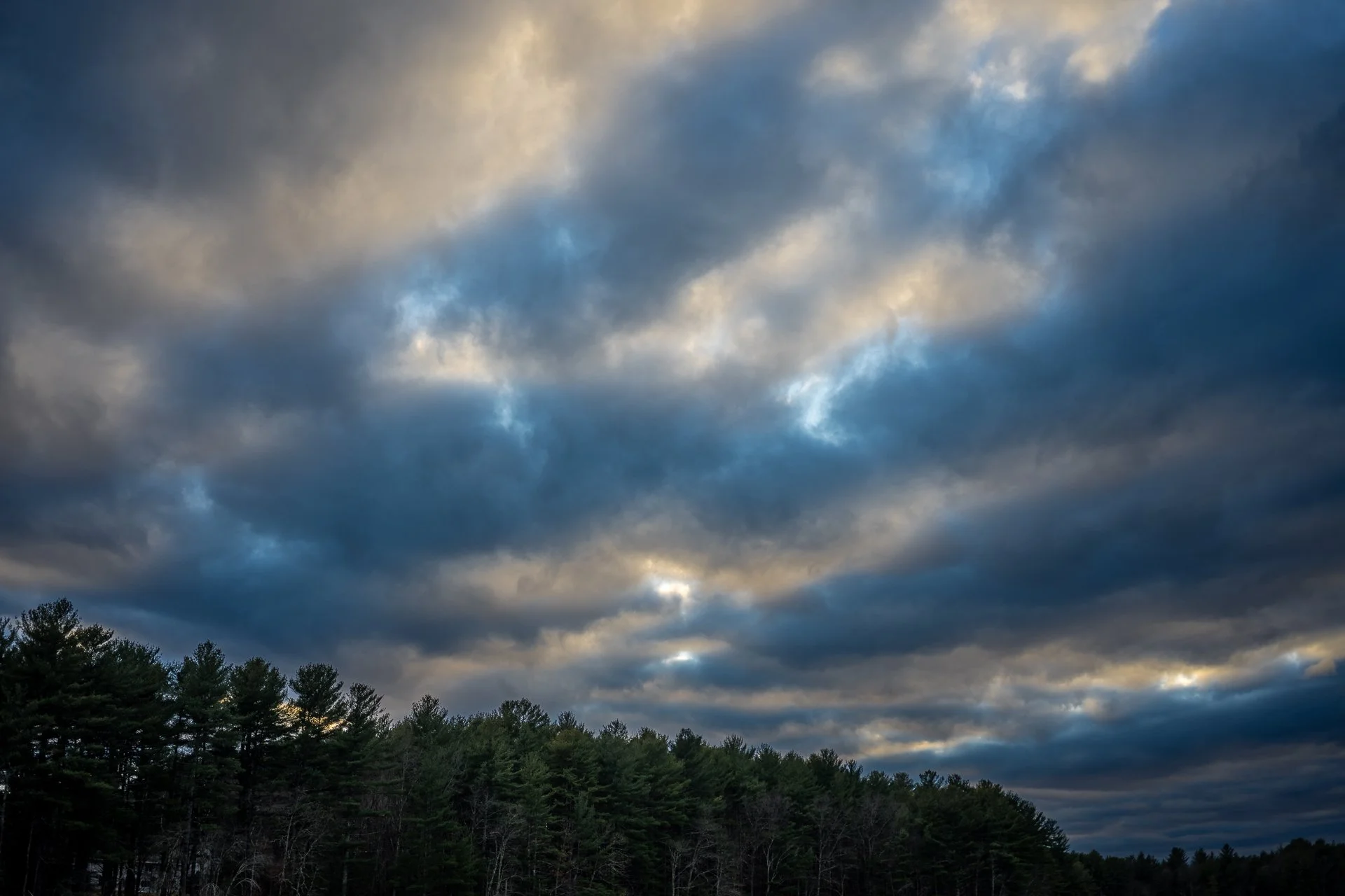 November 27, 2025 - Sun rays through the clouds. Groton, MA