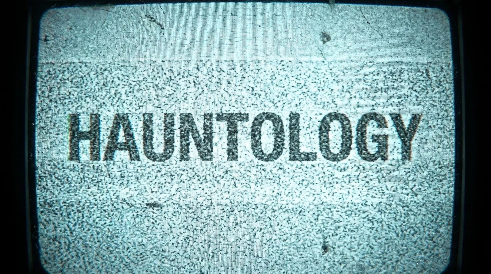 The word HAUNTOLOGY on a television screen full of static