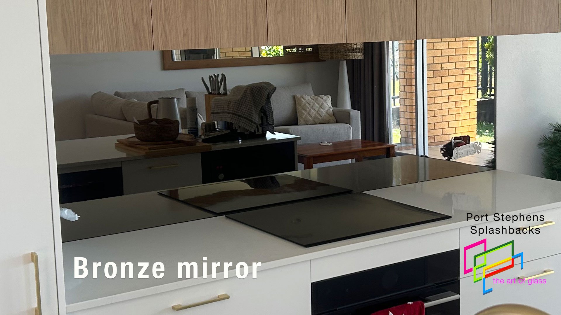 Bronze mirror splashback giving a warm tone for a home in Shoal Bay
