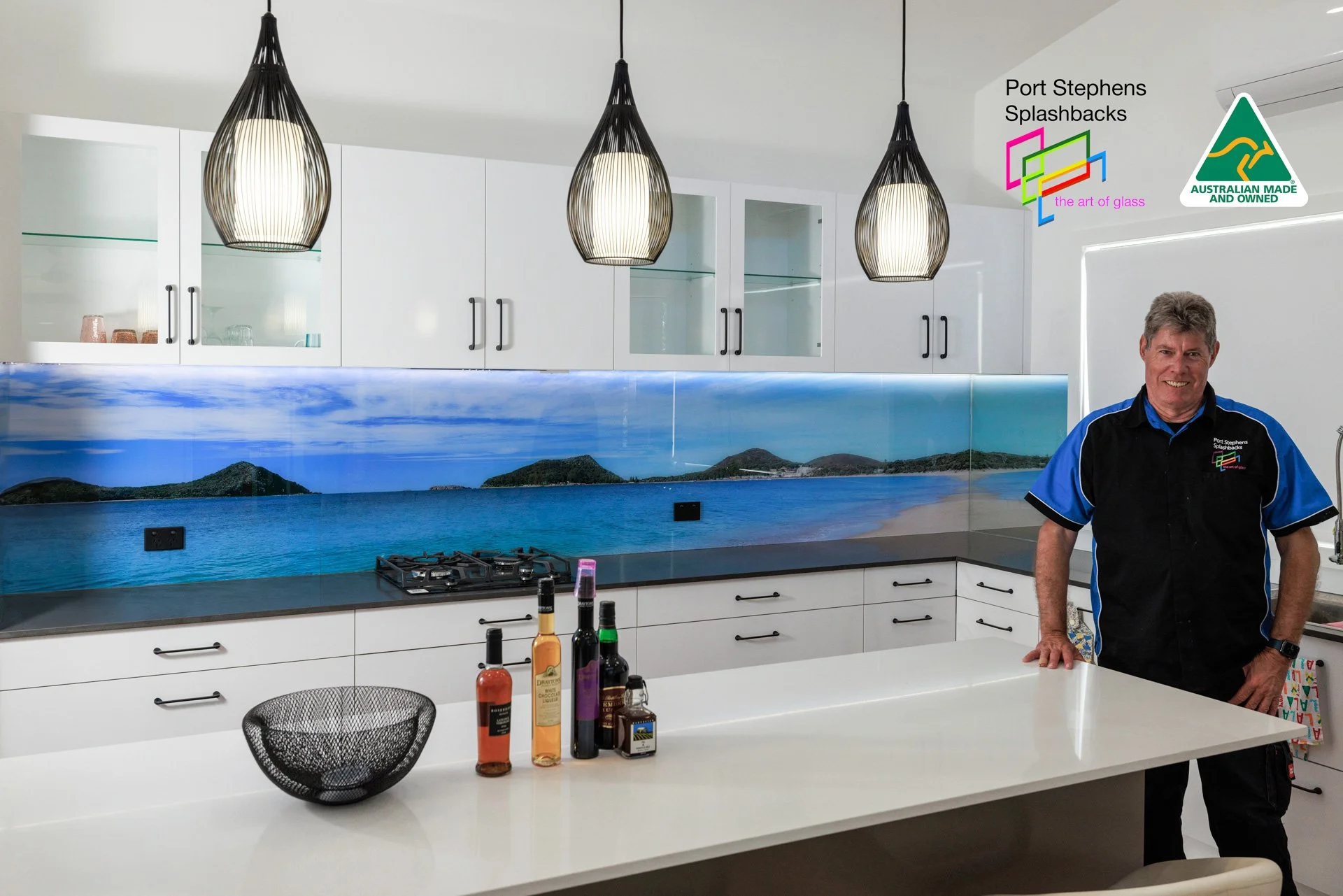 ACoastal photographic glass splashback installed in a modern Port Stephens kitchen
