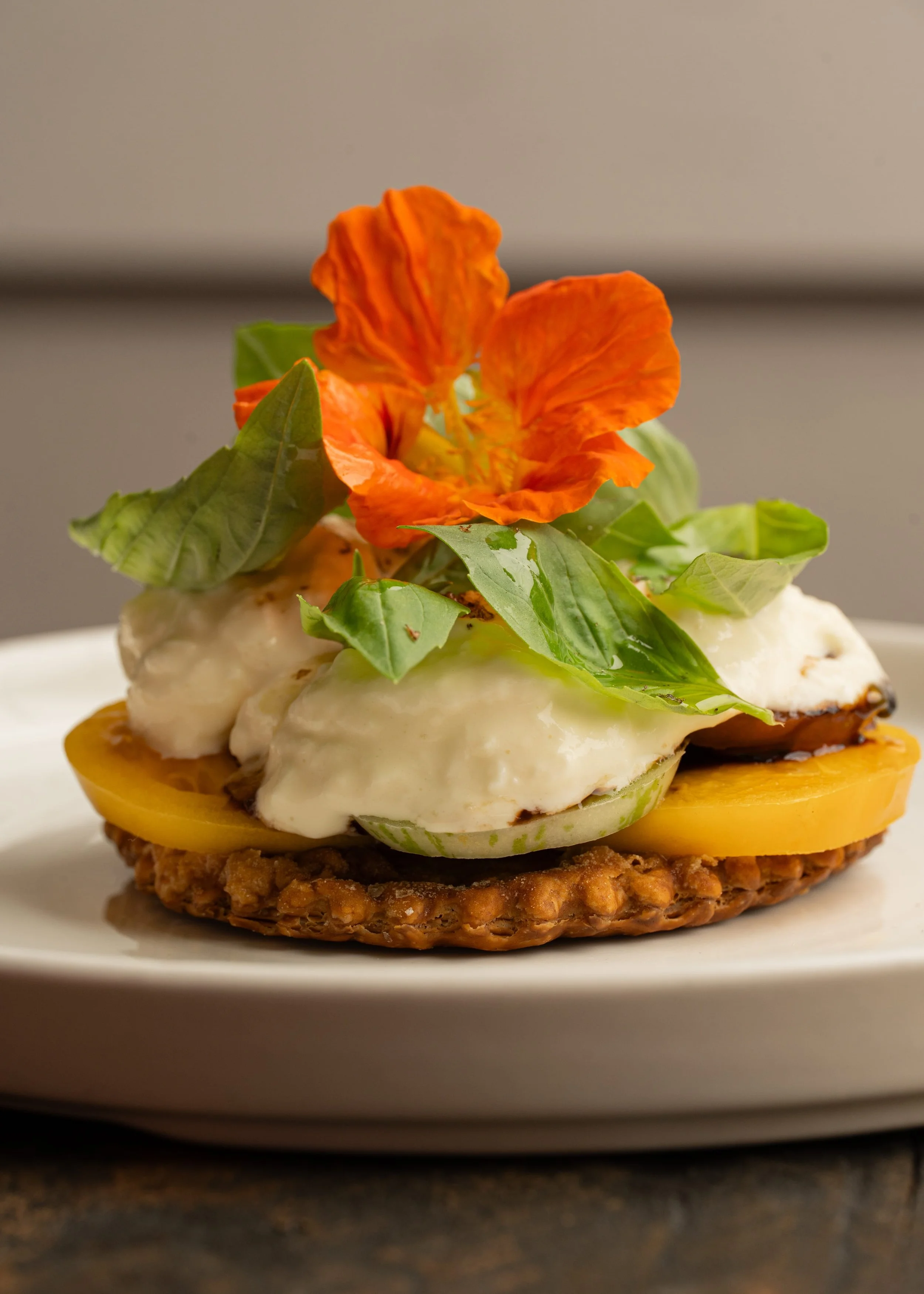 Heirloom tomato tart, stracciatella, basil, aged balsamic