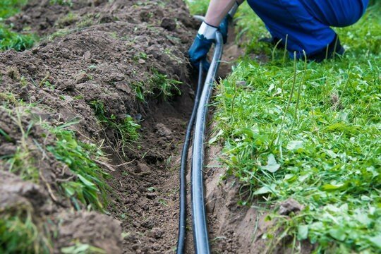 Large scale underground irrigation system used to water large surfaces of grass