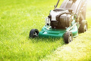 Hand powered lawn mower used to cut grass on smaller areas